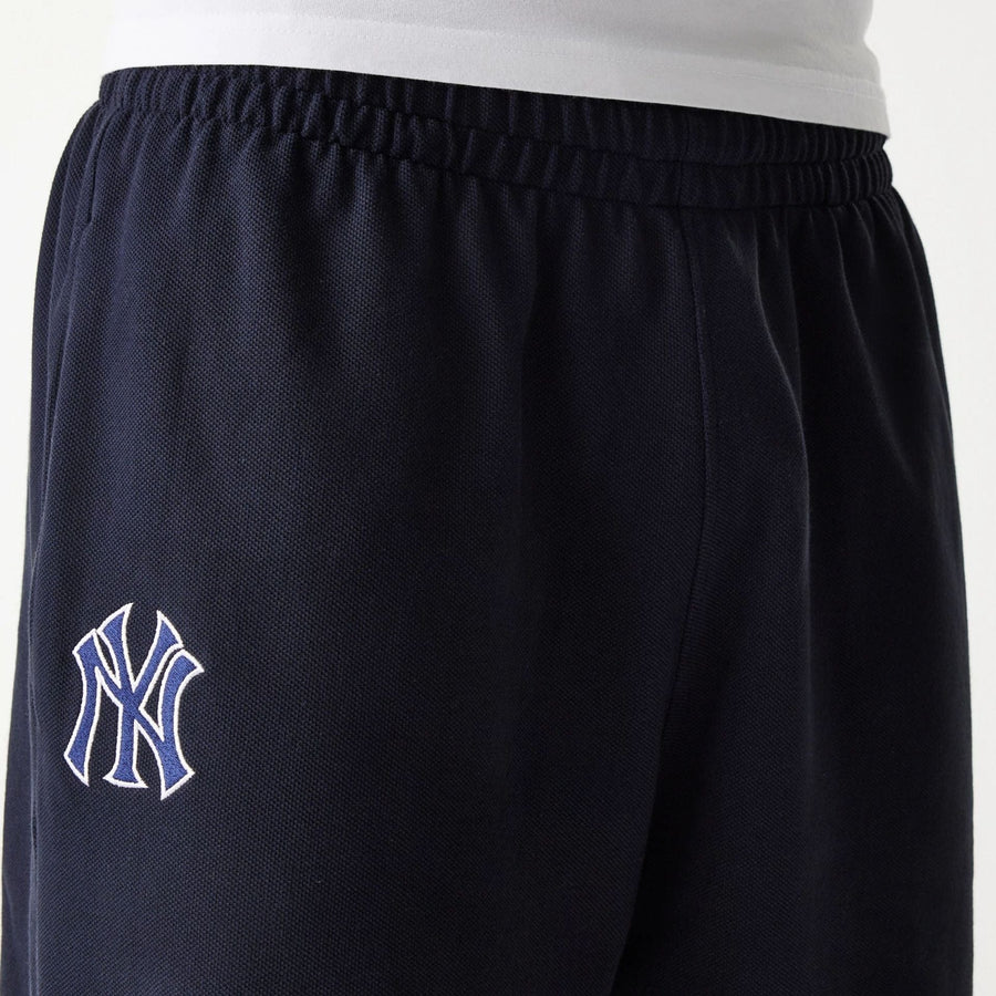 The Male model is wearing New York Yankees MLB Pique Navy Shorts 4