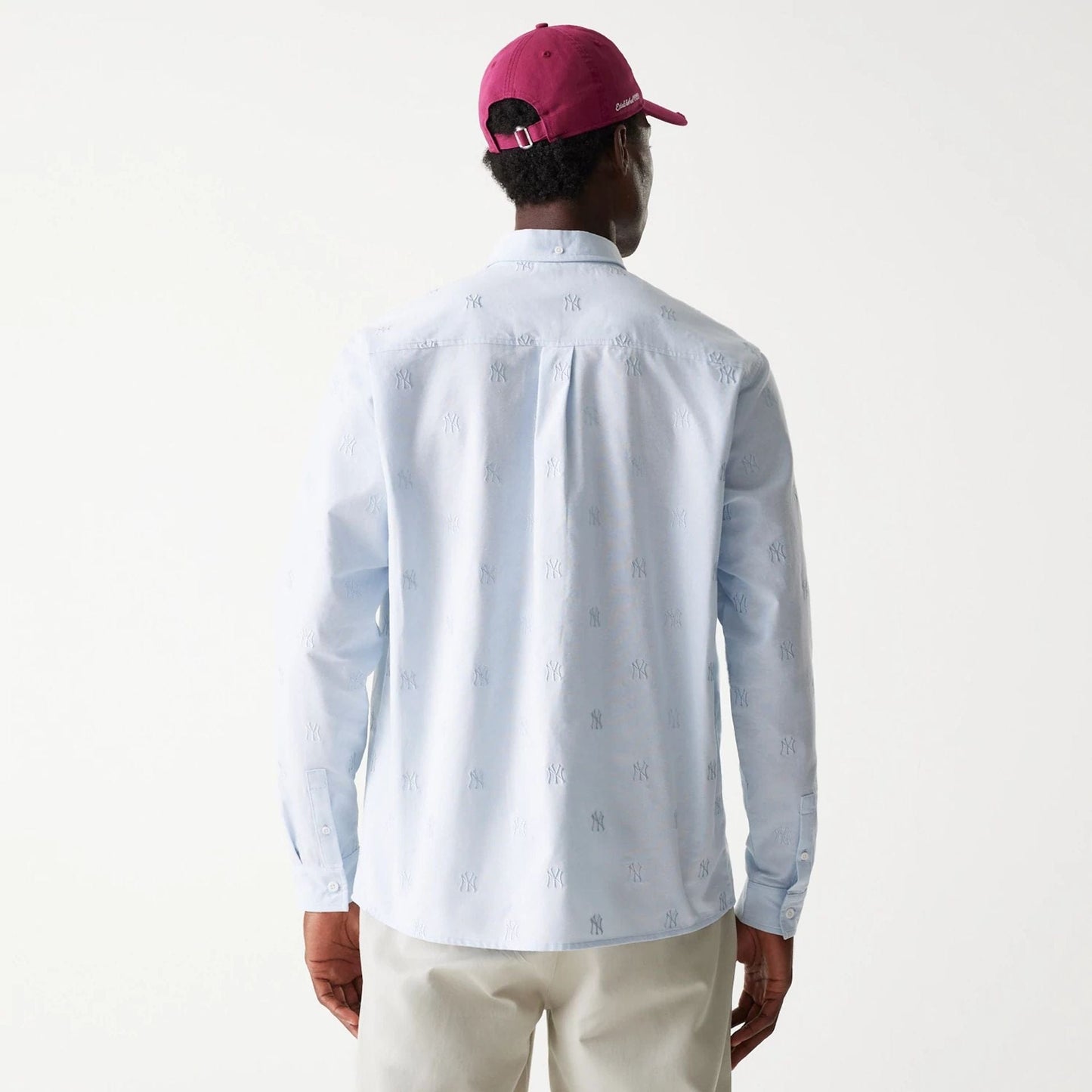 The Male model is wearing New York Yankees MLB Monogram Pastel Blue Long Sleeve Shirt 2