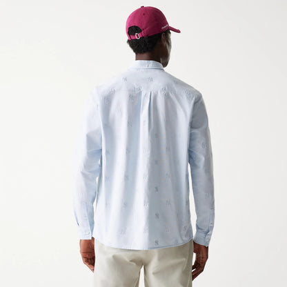 The Male model is wearing New York Yankees MLB Monogram Pastel Blue Long Sleeve Shirt 2