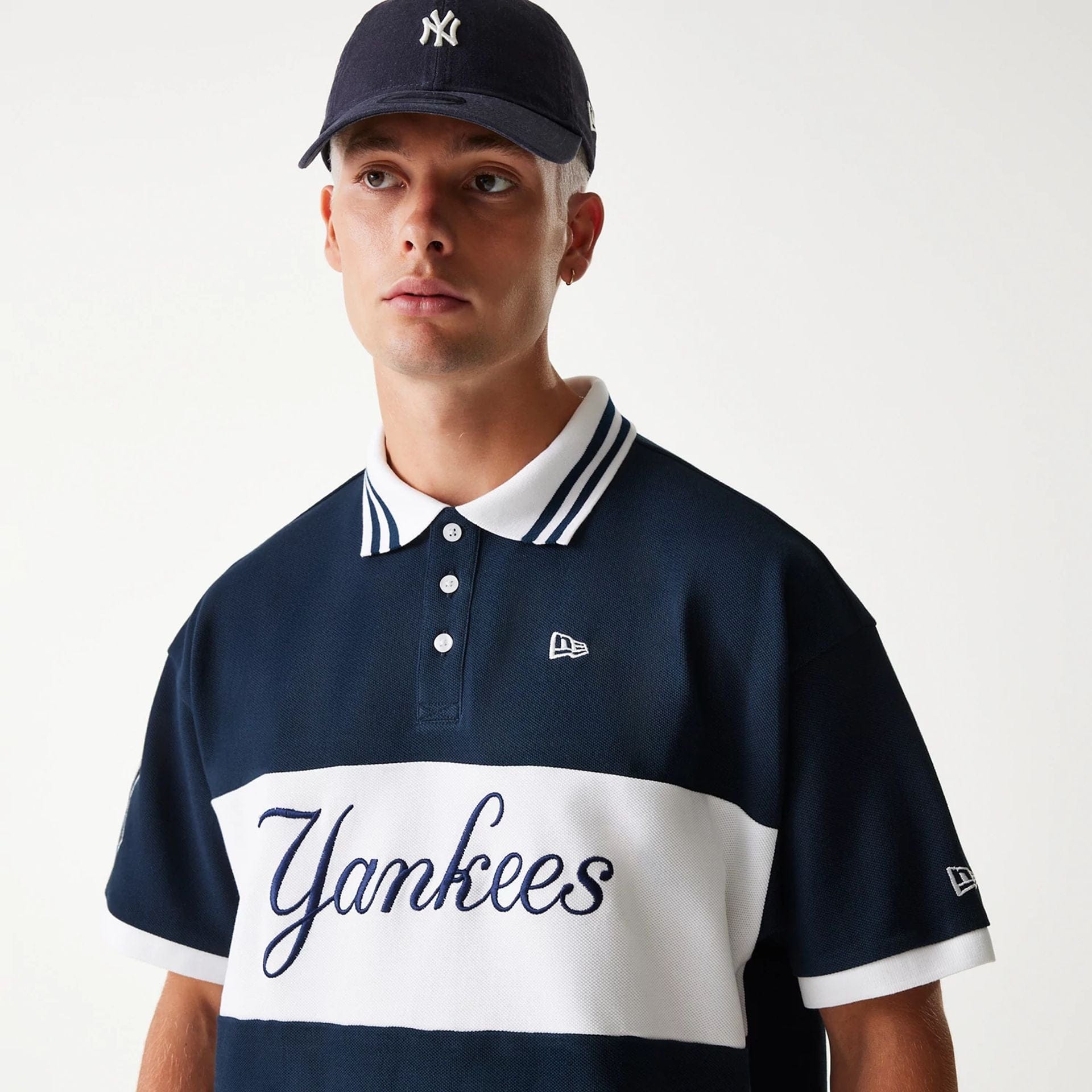 The Male model is wearing New York Yankees MLB Graphic Navy Polo Shirt 5