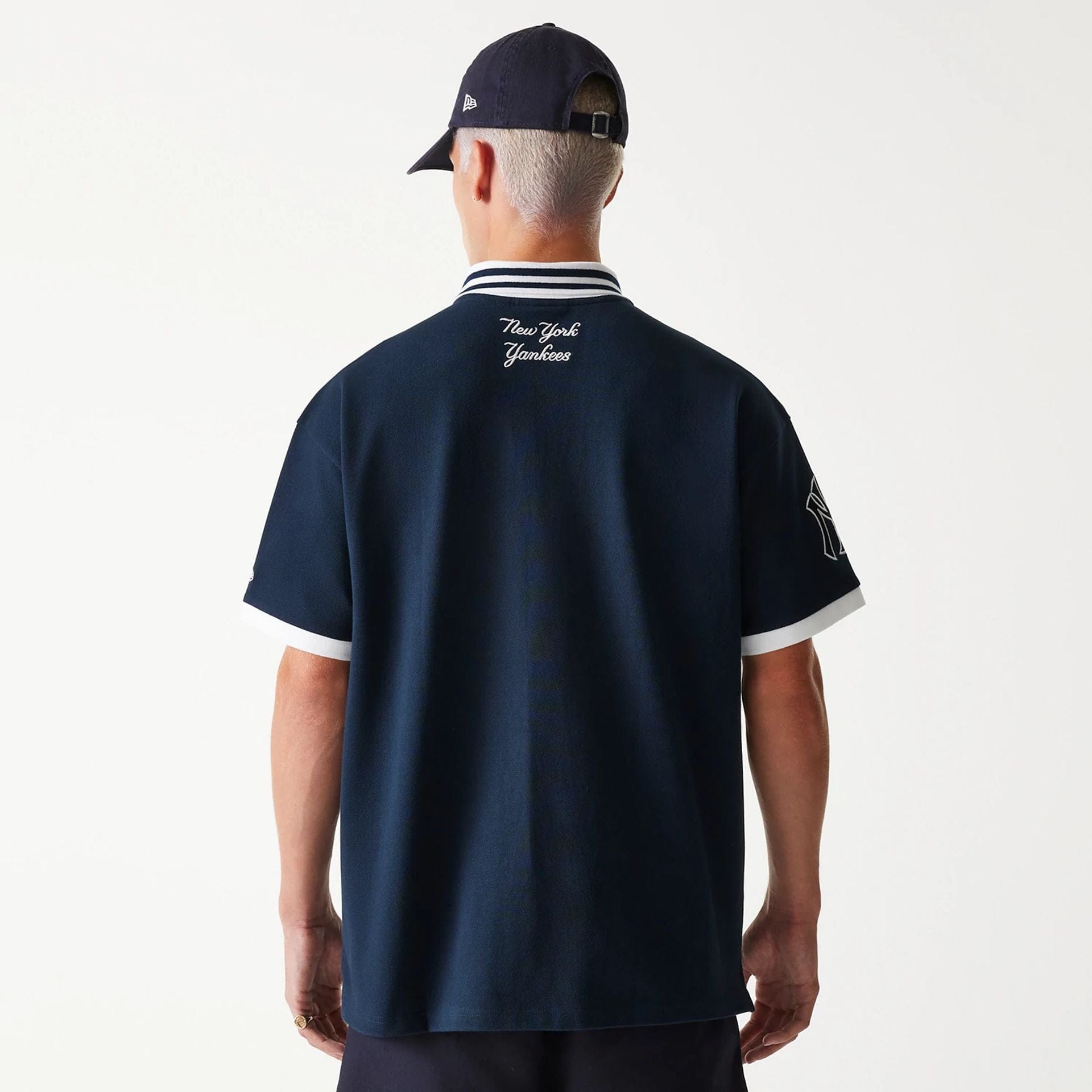The Male model is wearing New York Yankees MLB Graphic Navy Polo Shirt 2