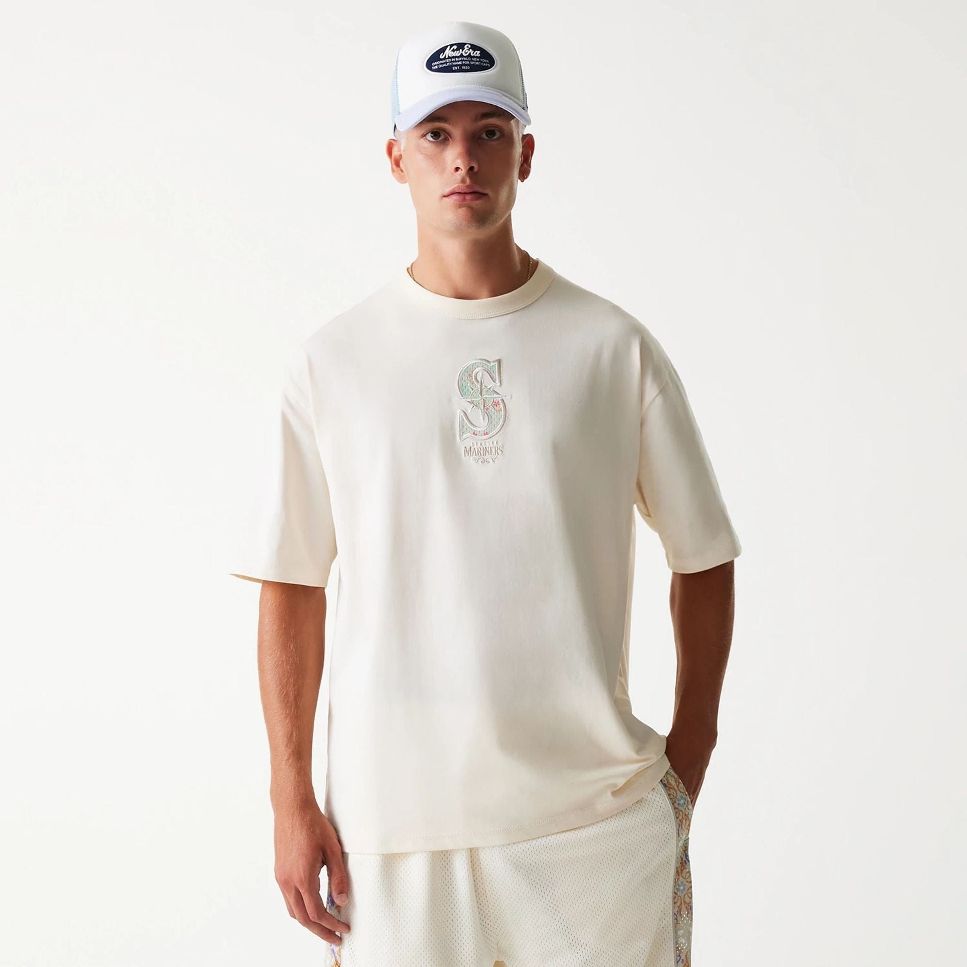The Male model is wearing Seattle Mariners MLB Infill Open White Oversized T-Shirt 4