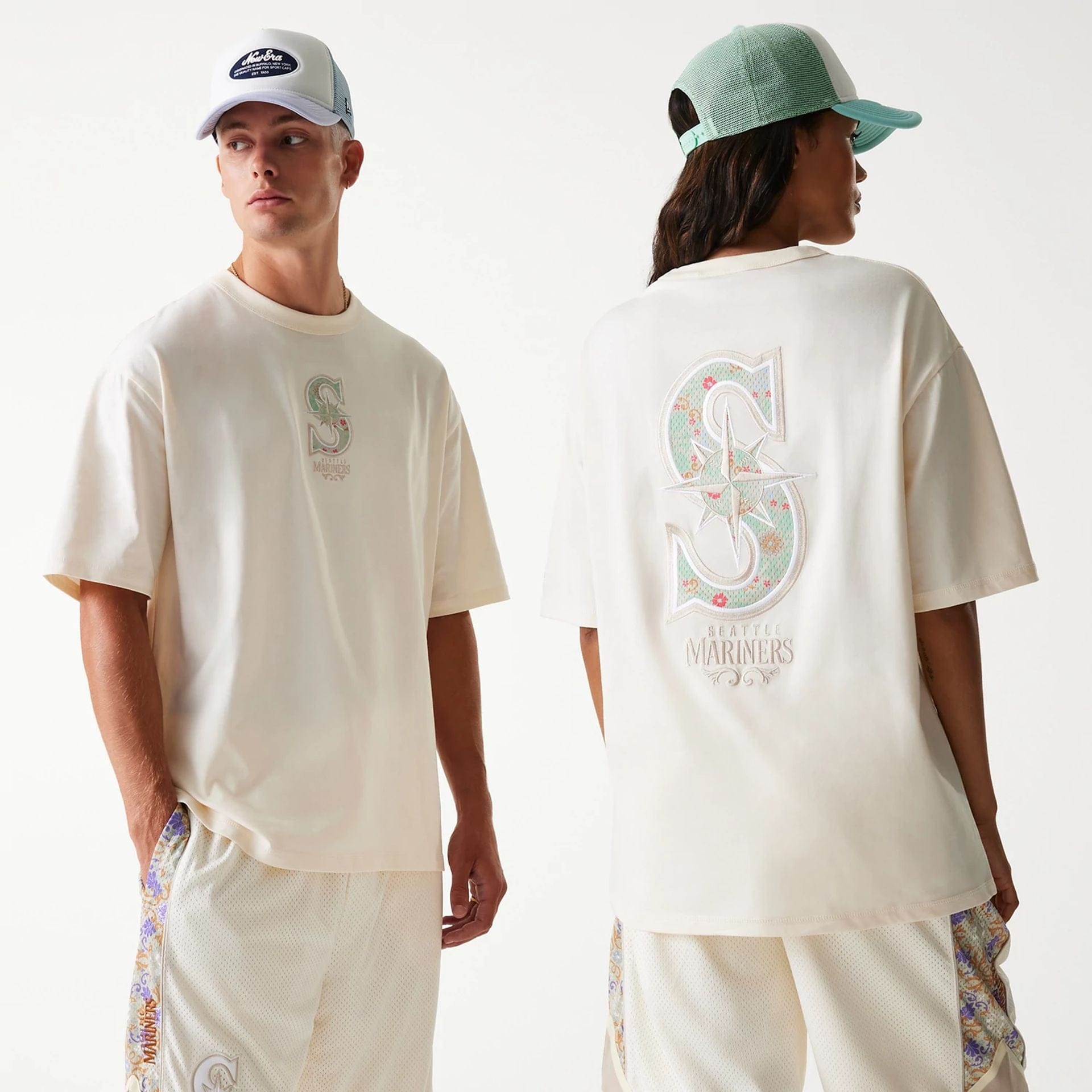 The Male model is wearing Seattle Mariners MLB Infill Open White Oversized T-Shirt 1