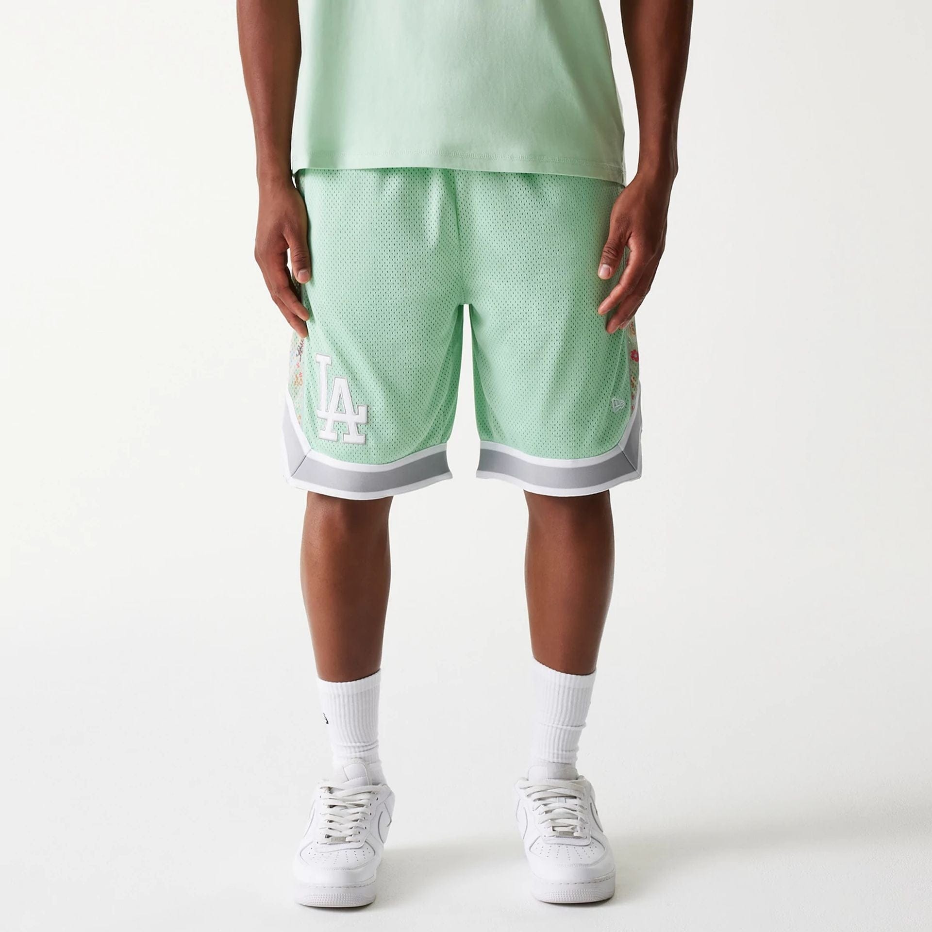 The Male model is wearing LA Dodgers MLB Infill Pastel Green Mesh Shorts 1