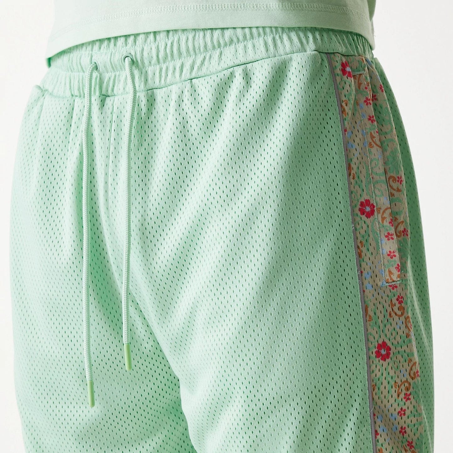 The Male model is wearing LA Dodgers MLB Infill Pastel Green Mesh Shorts 7