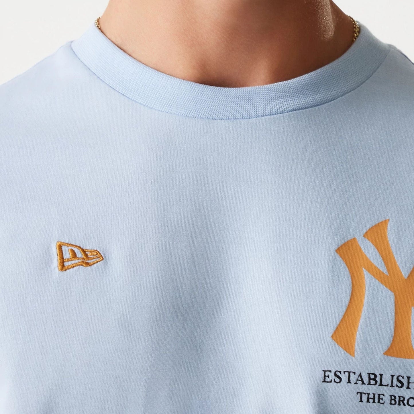 The Male model is wearing New York Yankees MLB Baseball Graphic Pastel Blue Oversized T-Shirt 7