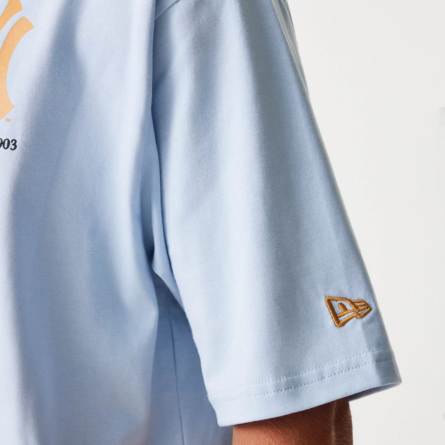 The Male model is wearing New York Yankees MLB Baseball Graphic Pastel Blue Oversized T-Shirt 8