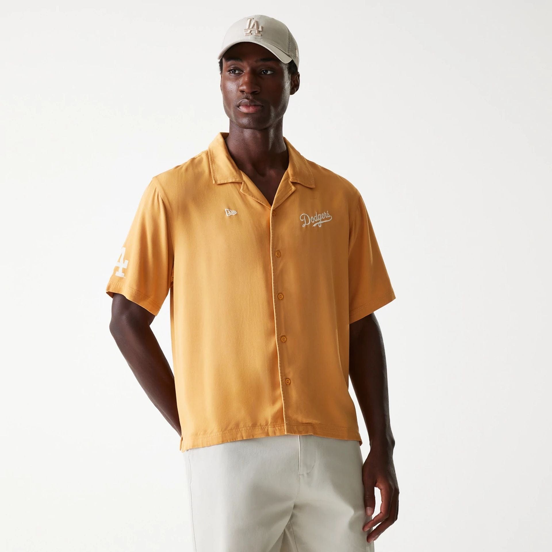 The Male model is wearing LA Dodgers MLB Graphic Beige Revere Short Sleeve Shirt 1