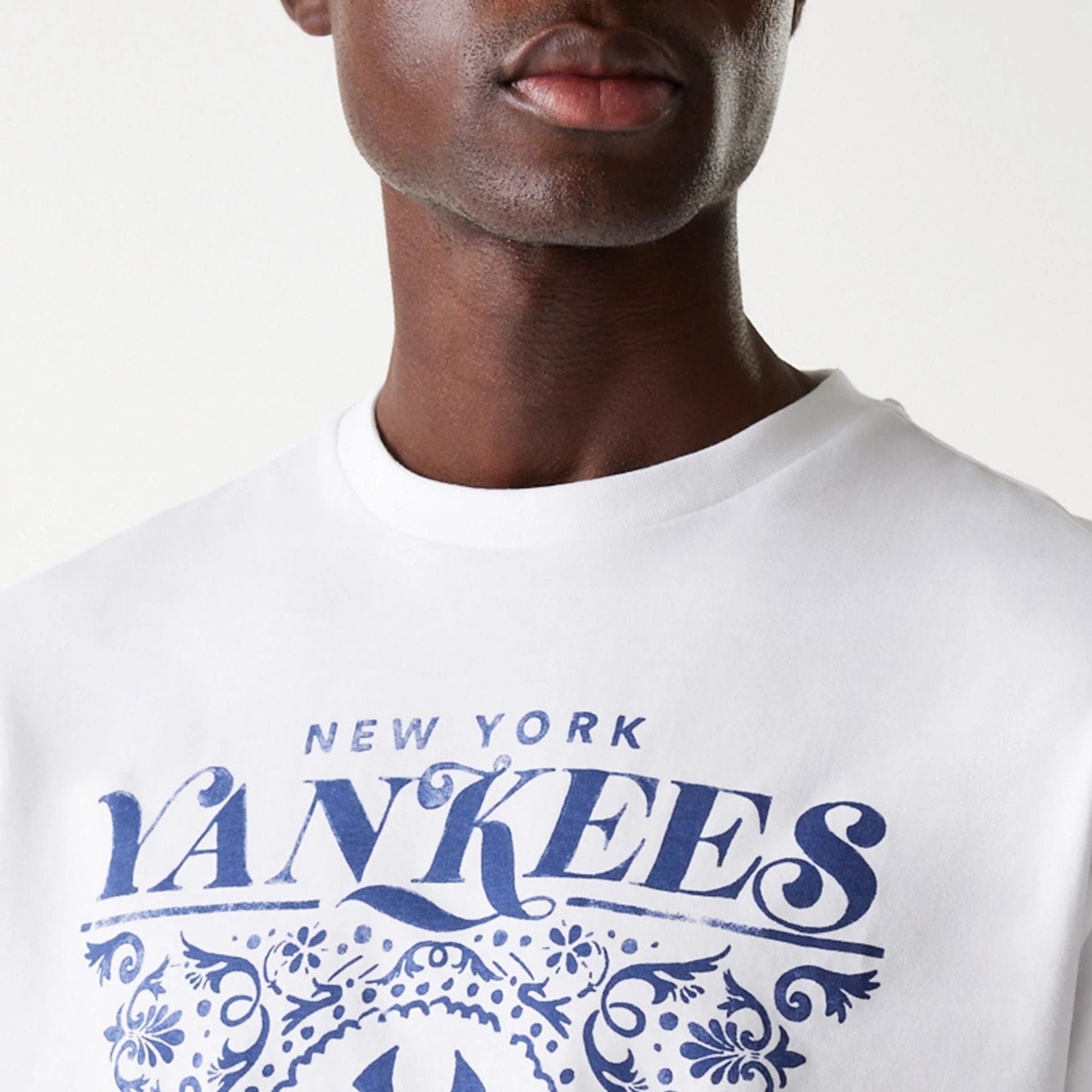The Male model is wearing New York Yankees MLB Floral Graphic White Oversized T-Shirt 6