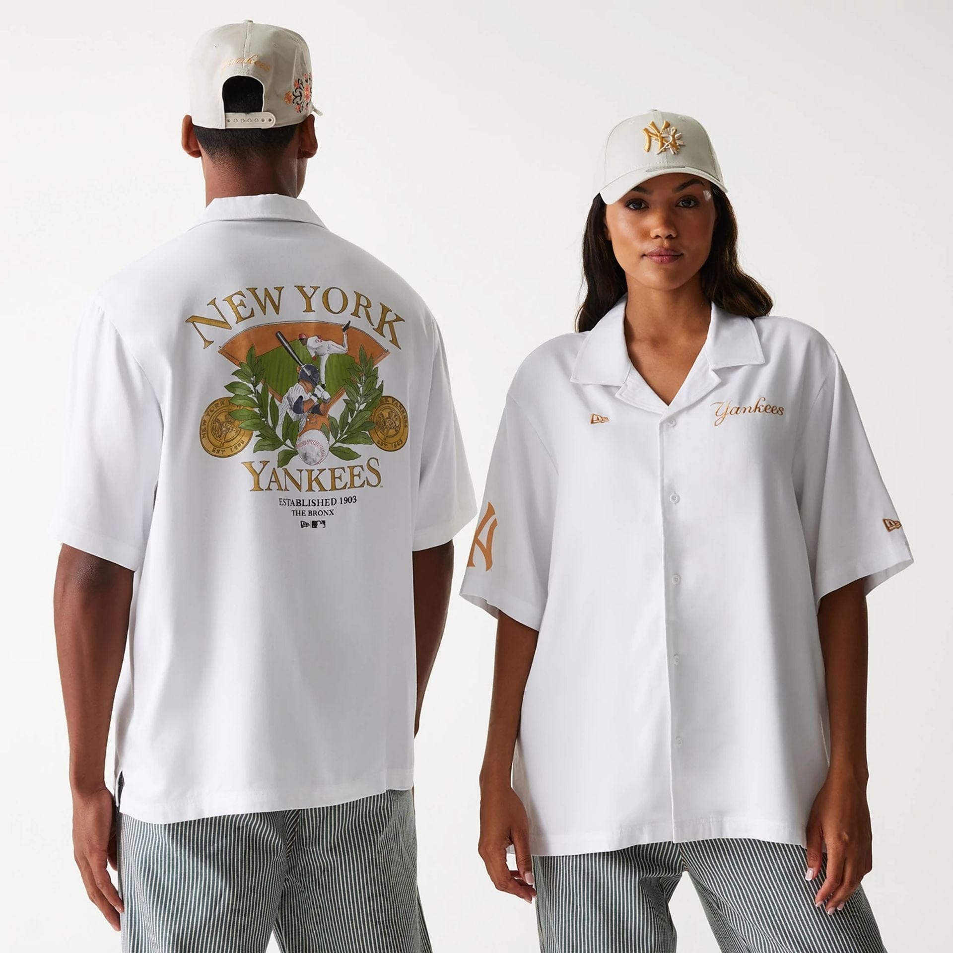 The Male model is wearing New York Yankees MLB Graphic White Revere Short Sleeve Shirt 1