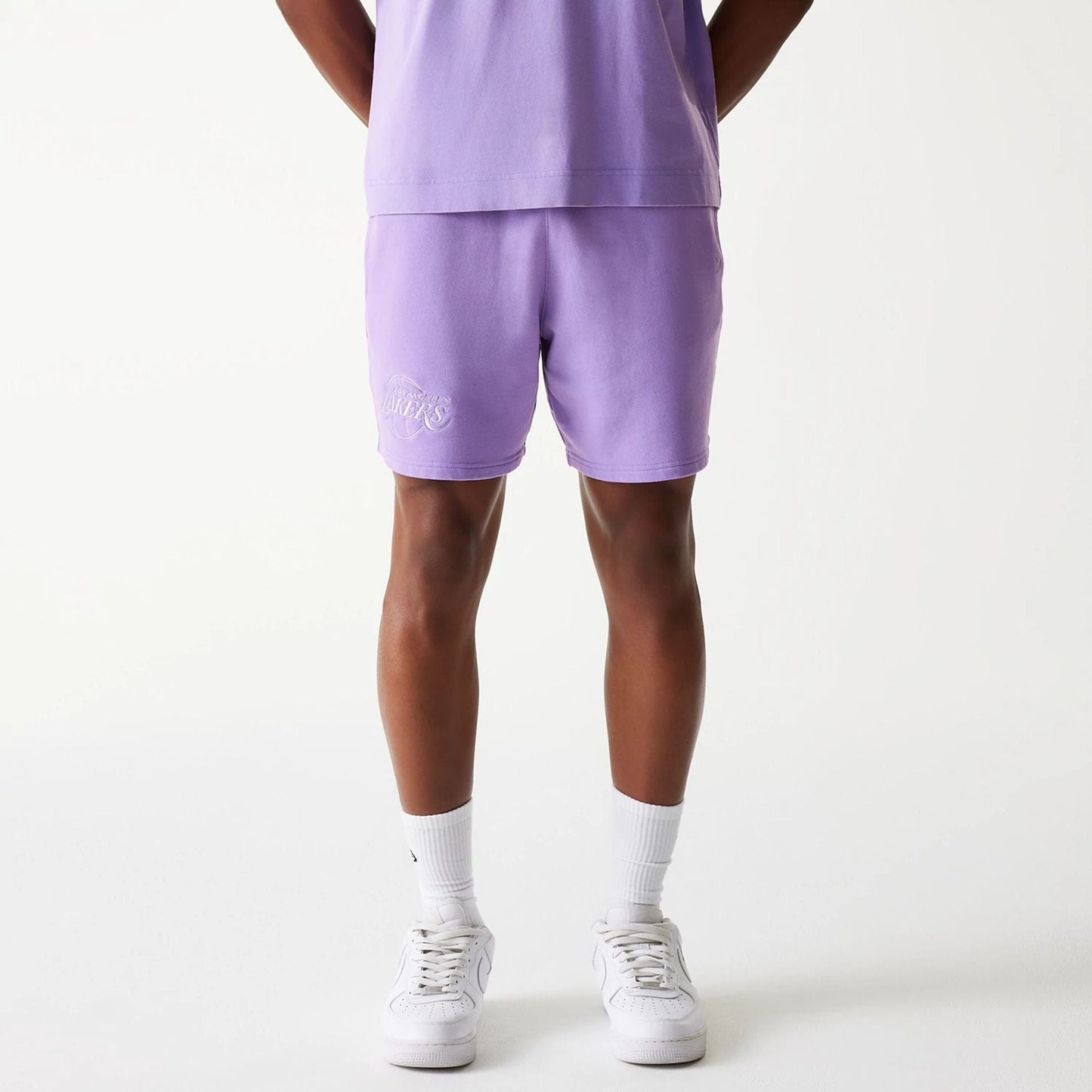 The Male model is wearing LA Lakers NBA Washed Purple Shorts 1