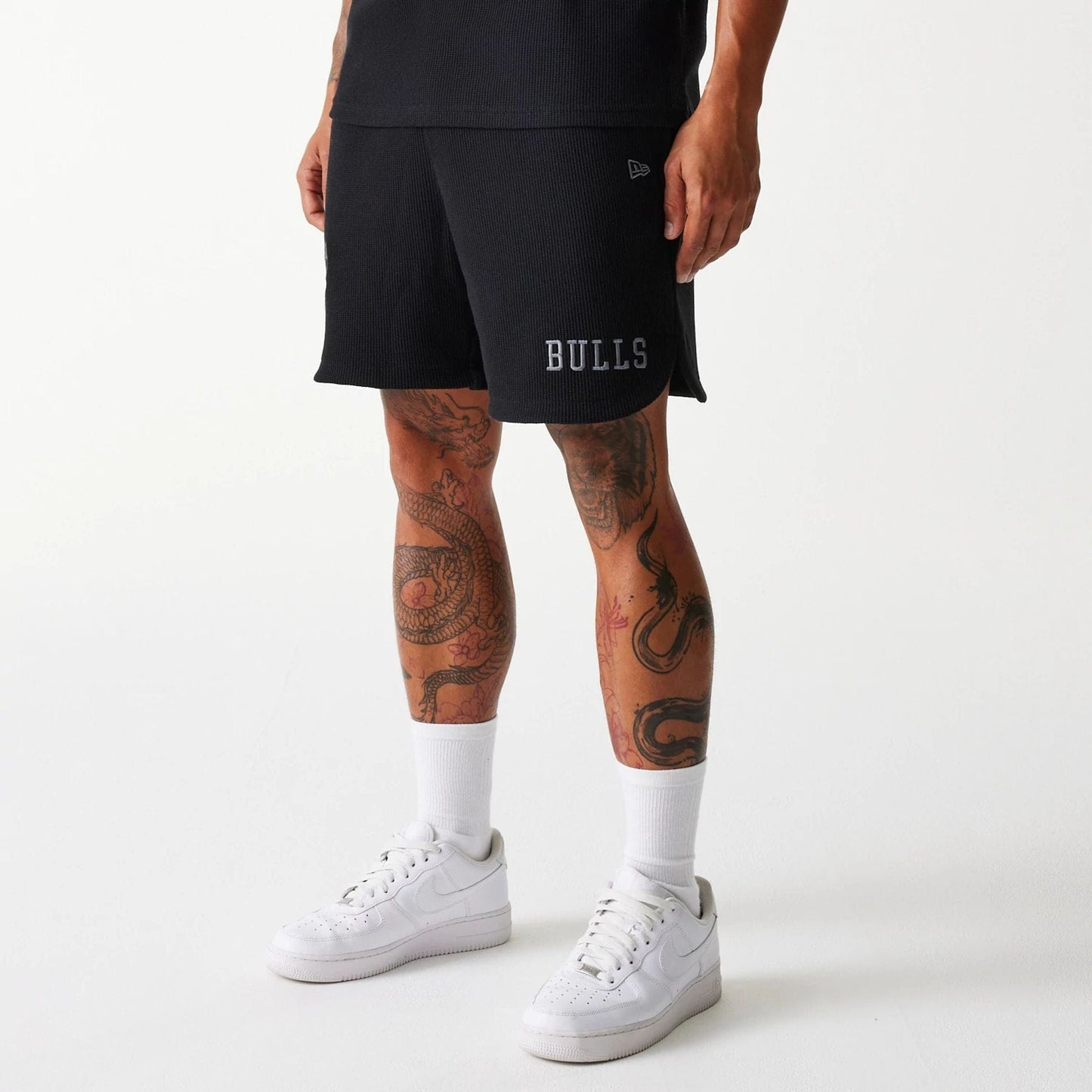 The Male model is wearing Chicago Bulls NBA Waffle Black Shorts 1