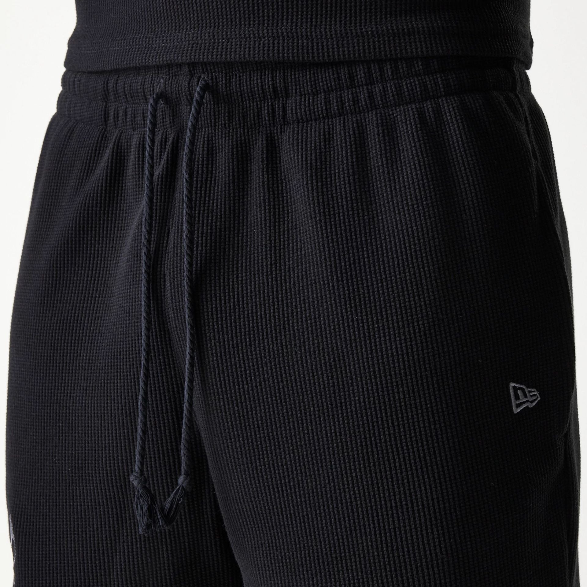 The Male model is wearing Chicago Bulls NBA Waffle Black Shorts 5