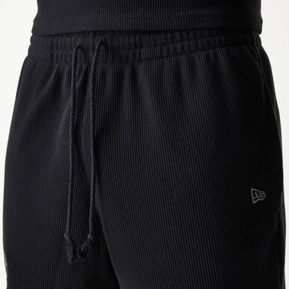 The Male model is wearing Chicago Bulls NBA Waffle Black Shorts 5