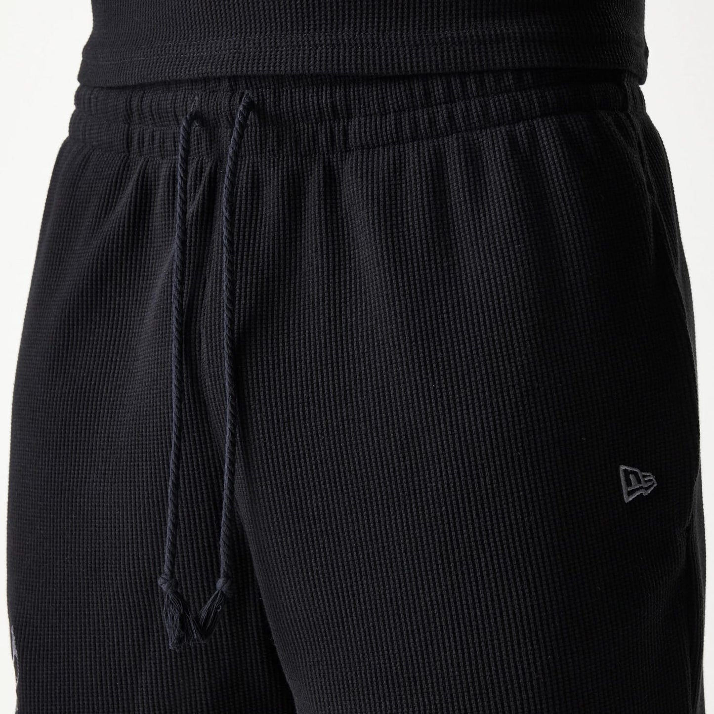 The Male model is wearing Chicago Bulls NBA Waffle Black Shorts 5