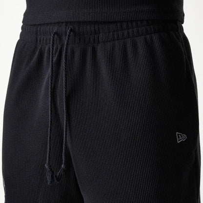 The Male model is wearing Chicago Bulls NBA Waffle Black Shorts 5