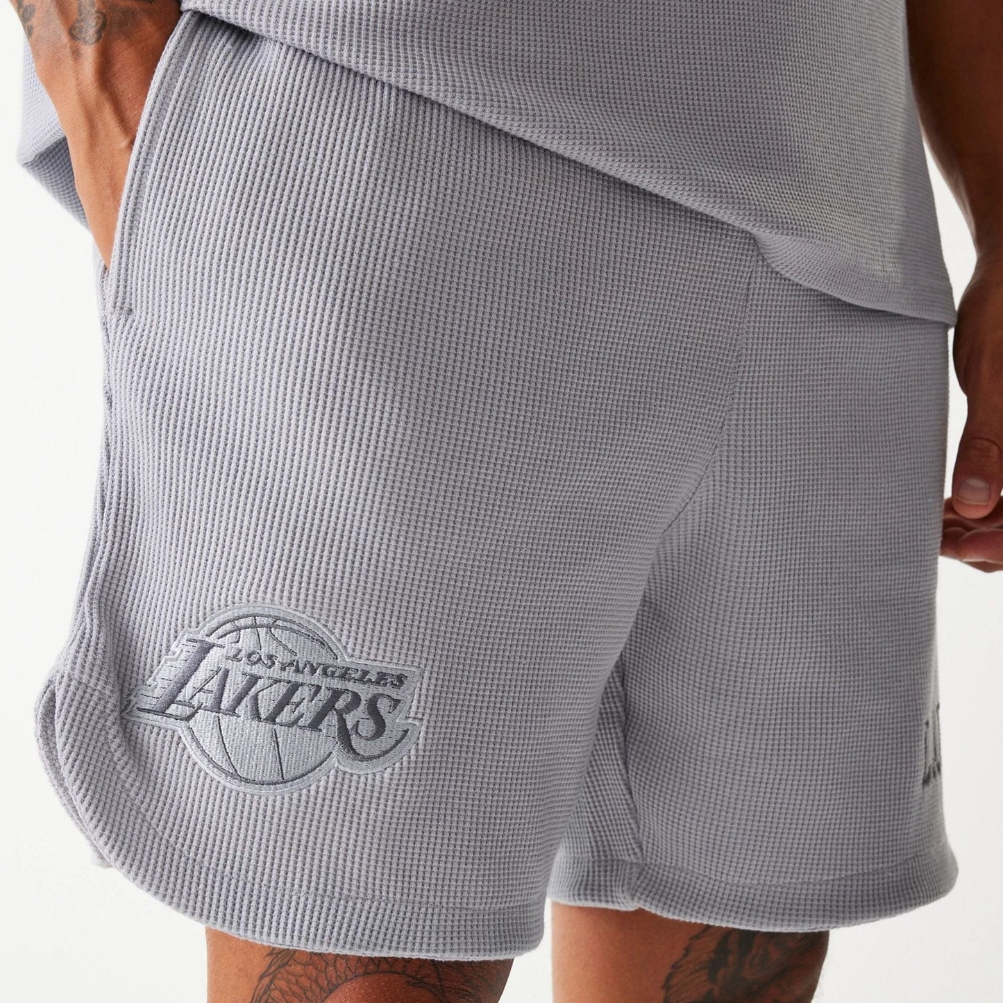The Male model is wearing LA Lakers NBA Waffle Grey Shorts 3