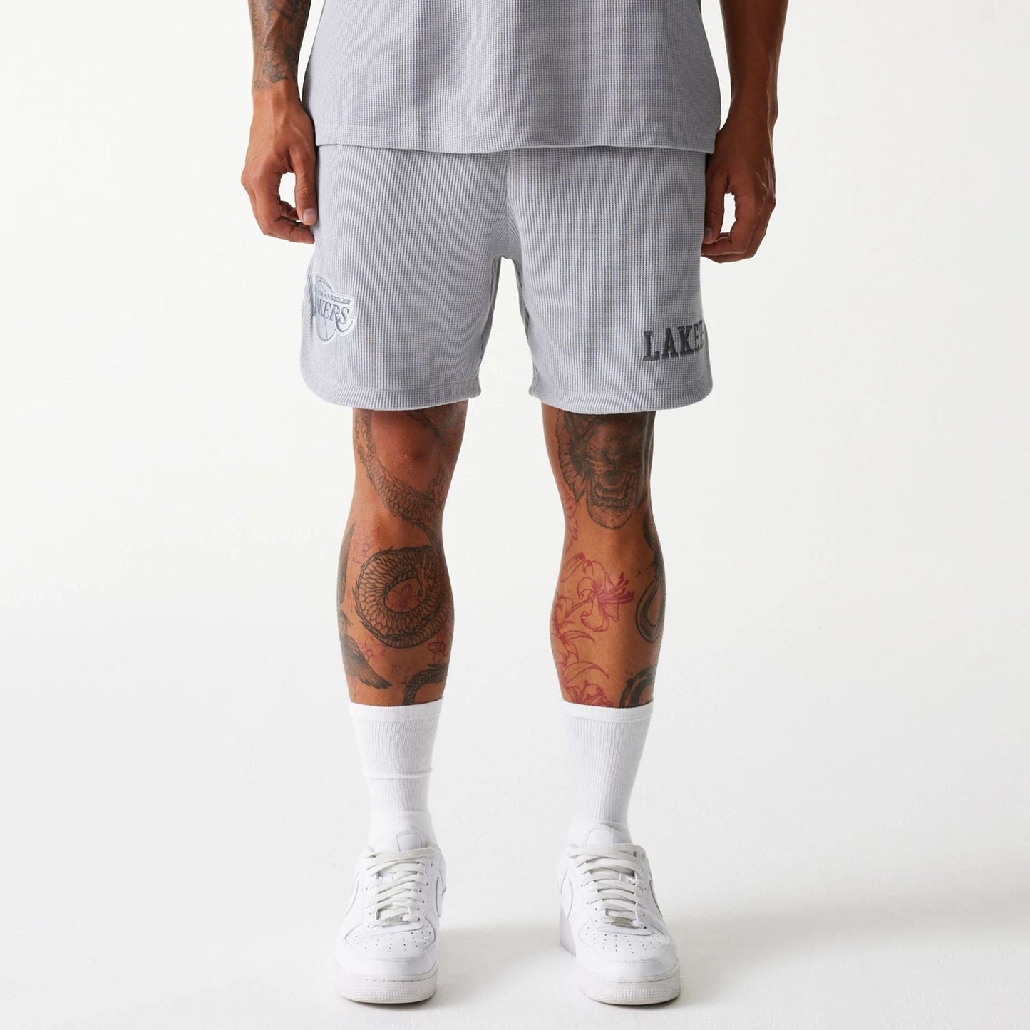 The Male model is wearing LA Lakers NBA Waffle Grey Shorts 1