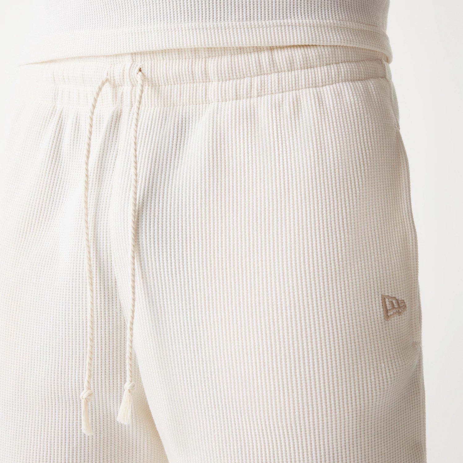 The Male model is wearing Boston Celtics NBA Waffle Open White Shorts 5