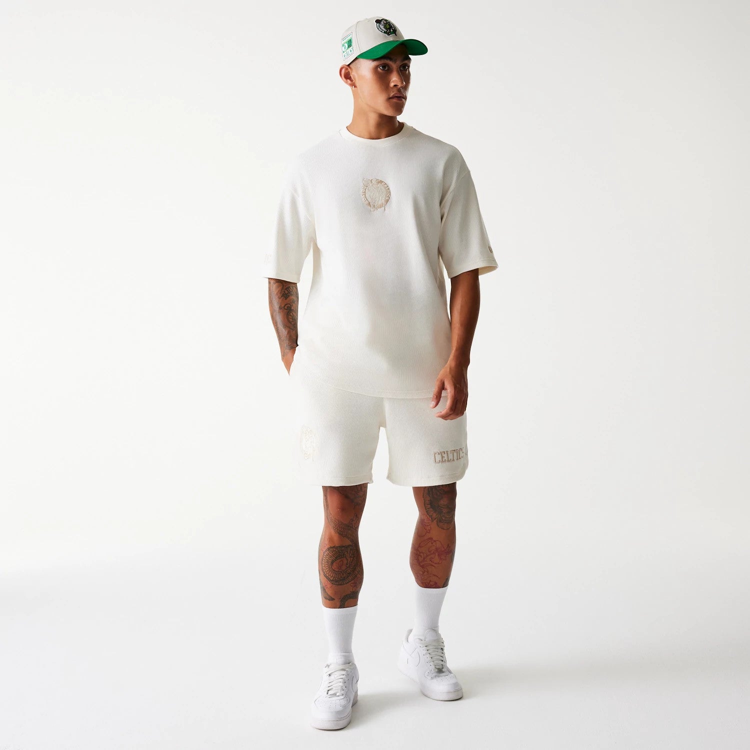 The Male model is wearing Boston Celtics NBA Waffle Open White Shorts 7