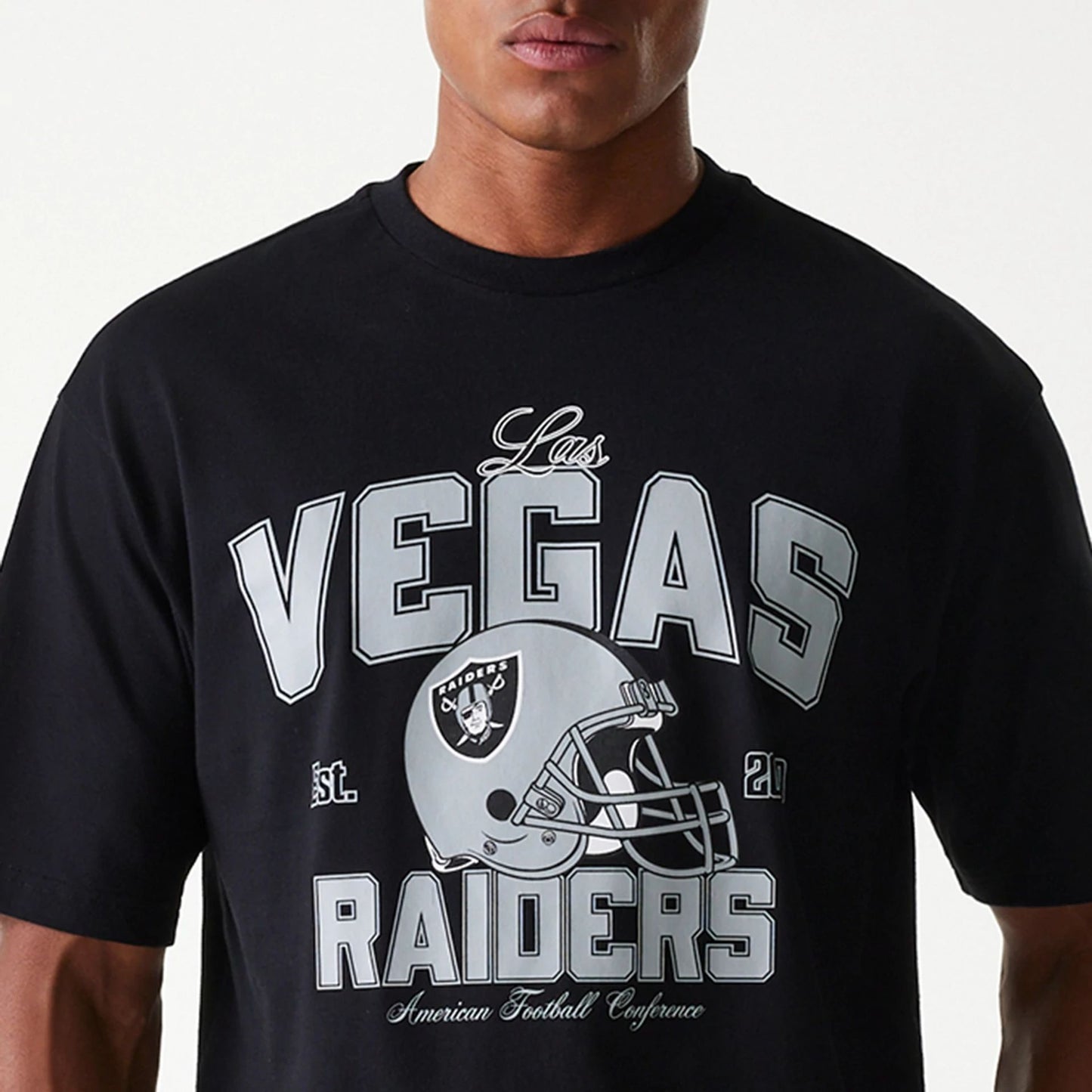 The Male model is wearing Las Vegas Raiders NFL Helmet Black Oversized T-Shirt 3