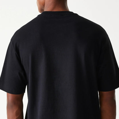 The Male model is wearing Las Vegas Raiders NFL Helmet Black Oversized T-Shirt 7