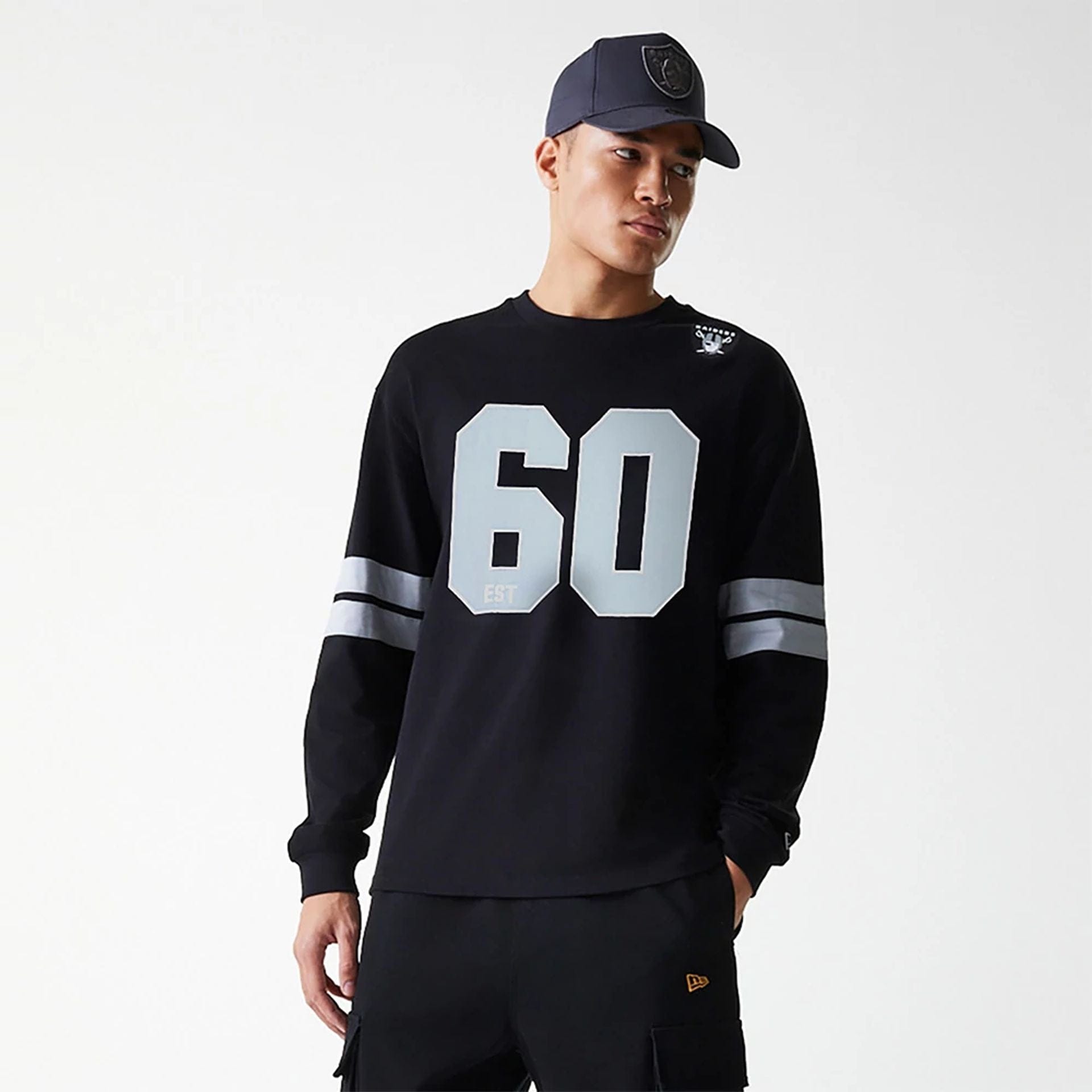 The Male model is wearing Las Vegas Raiders NFL Graphic Black Long Sleeve T-Shirt 3