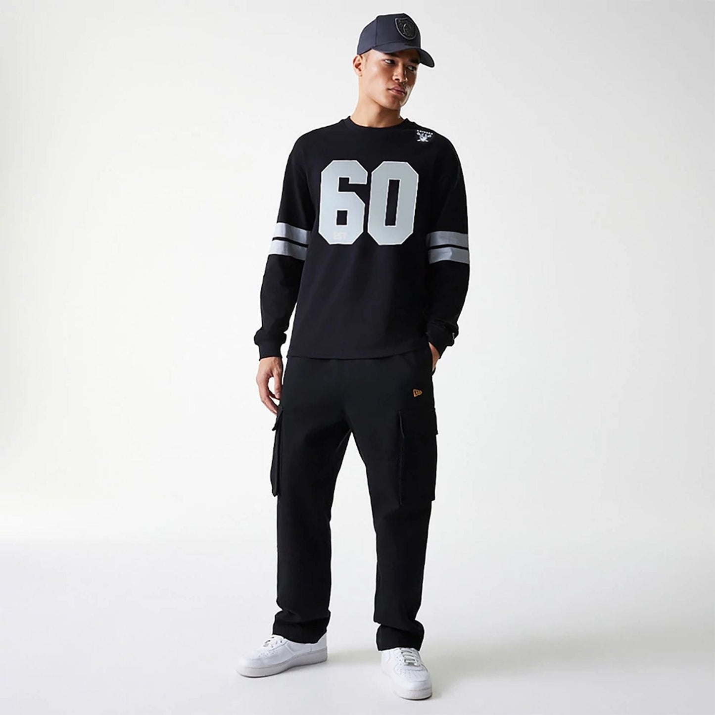 The Male model is wearing Las Vegas Raiders NFL Graphic Black Long Sleeve T-Shirt 6