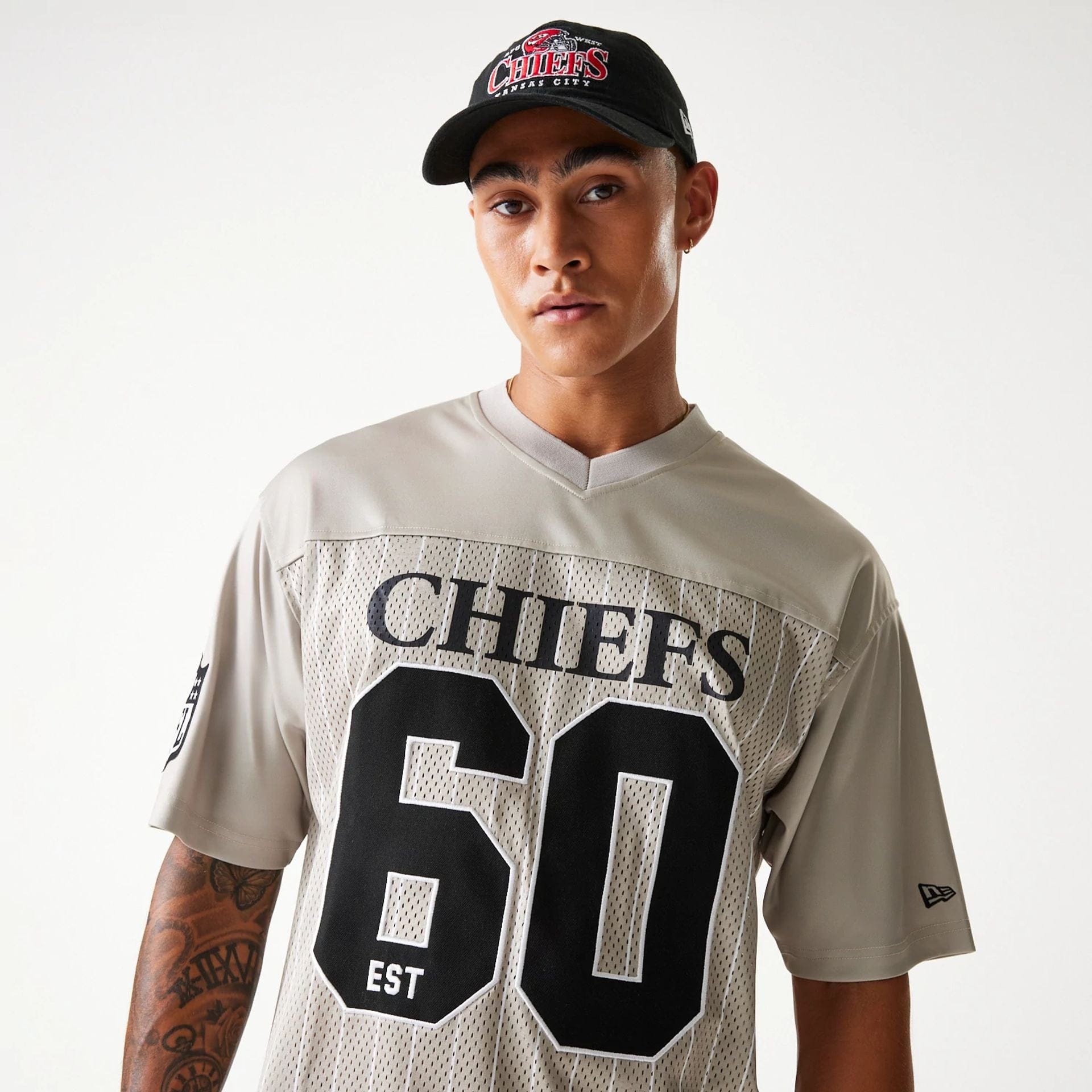 The Male model is wearing Kansas City Chiefs NFL Pinstripe Cream Mesh Jersey 3