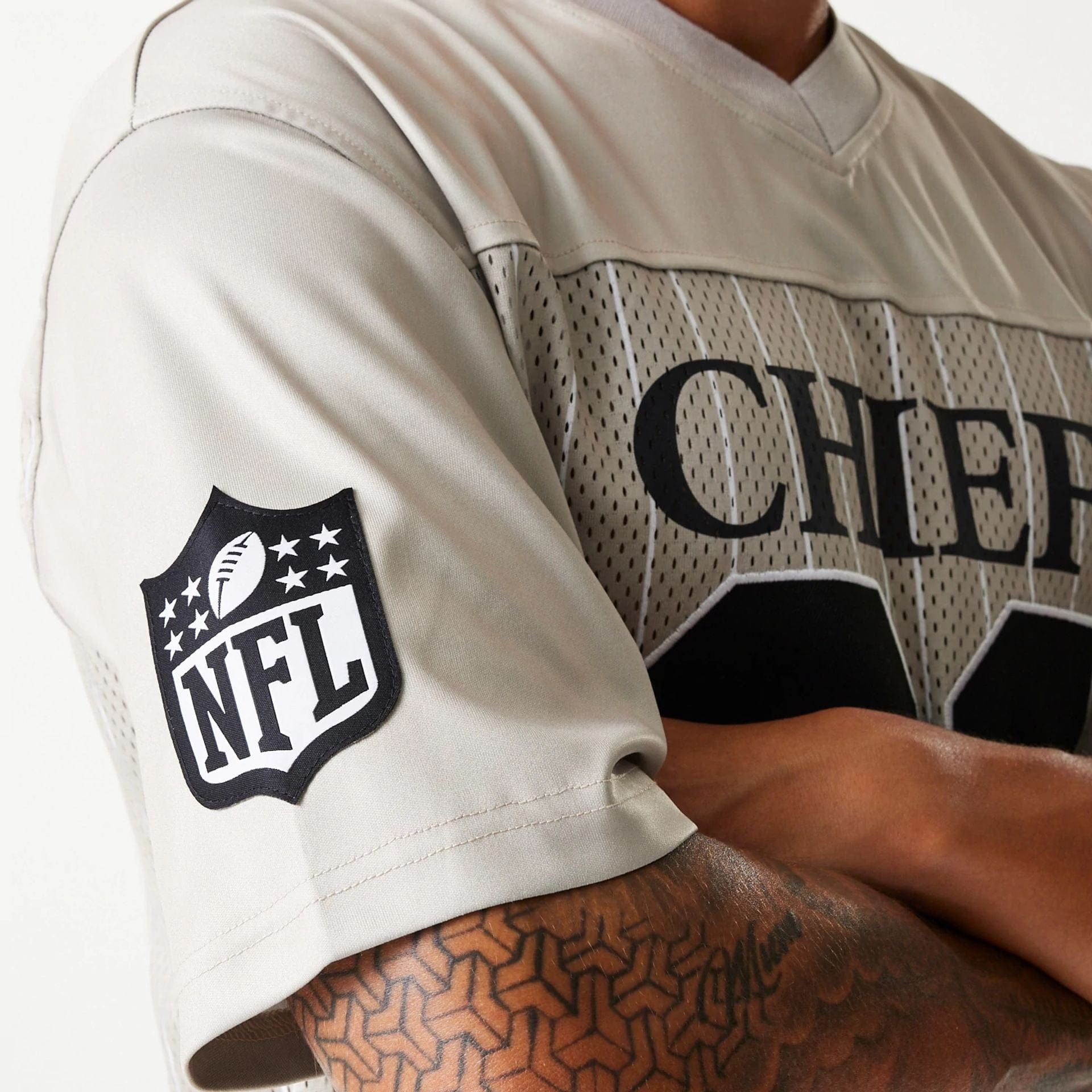 The Male model is wearing Kansas City Chiefs NFL Pinstripe Cream Mesh Jersey 5