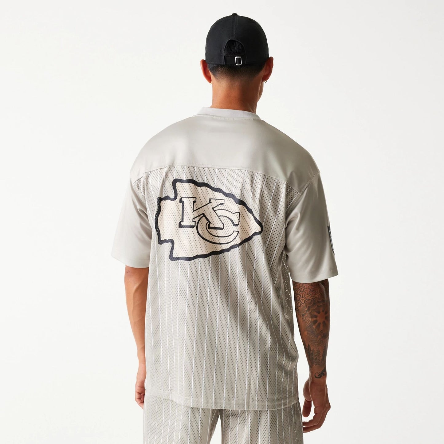 The Male model is wearing Kansas City Chiefs NFL Pinstripe Cream Mesh Jersey 2