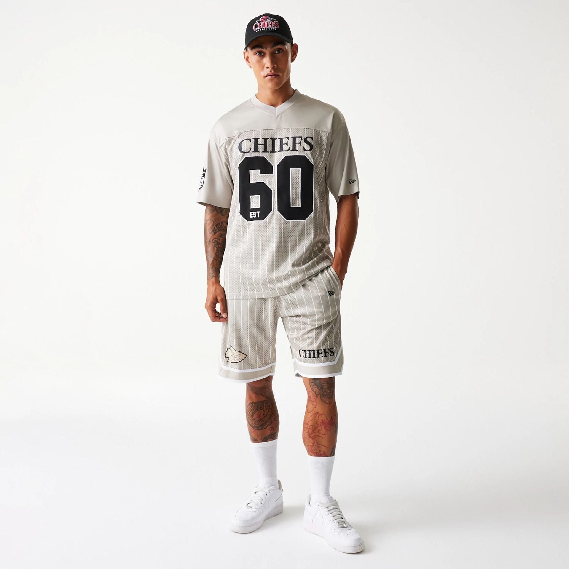 The Male model is wearing Kansas City Chiefs NFL Pinstripe Cream Mesh Jersey 8