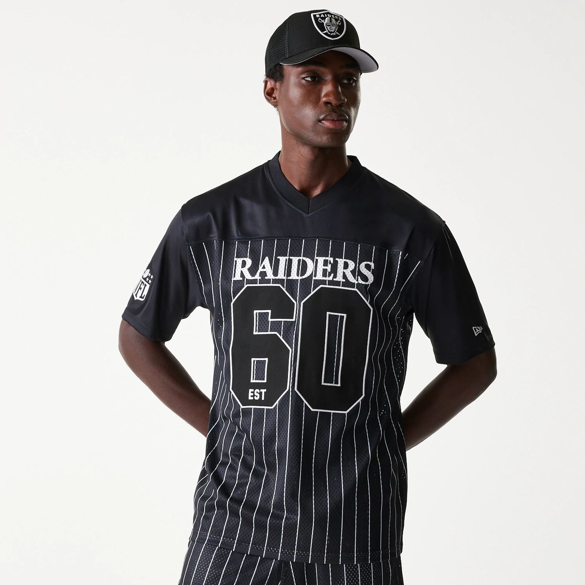 The Male model is wearing Las Vegas Raiders NFL Stripe Black Long Sleeve Jersey 1