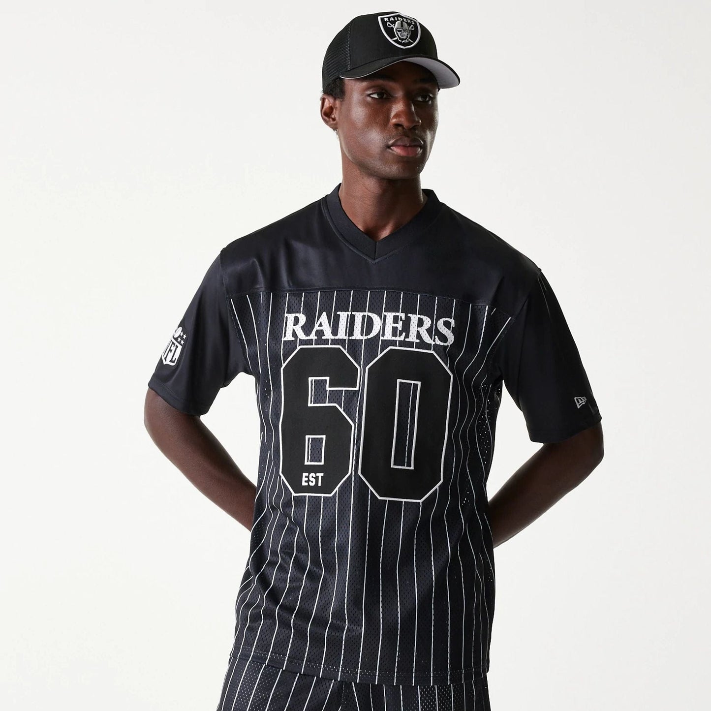 The Male model is wearing Las Vegas Raiders NFL Stripe Black Long Sleeve Jersey 1