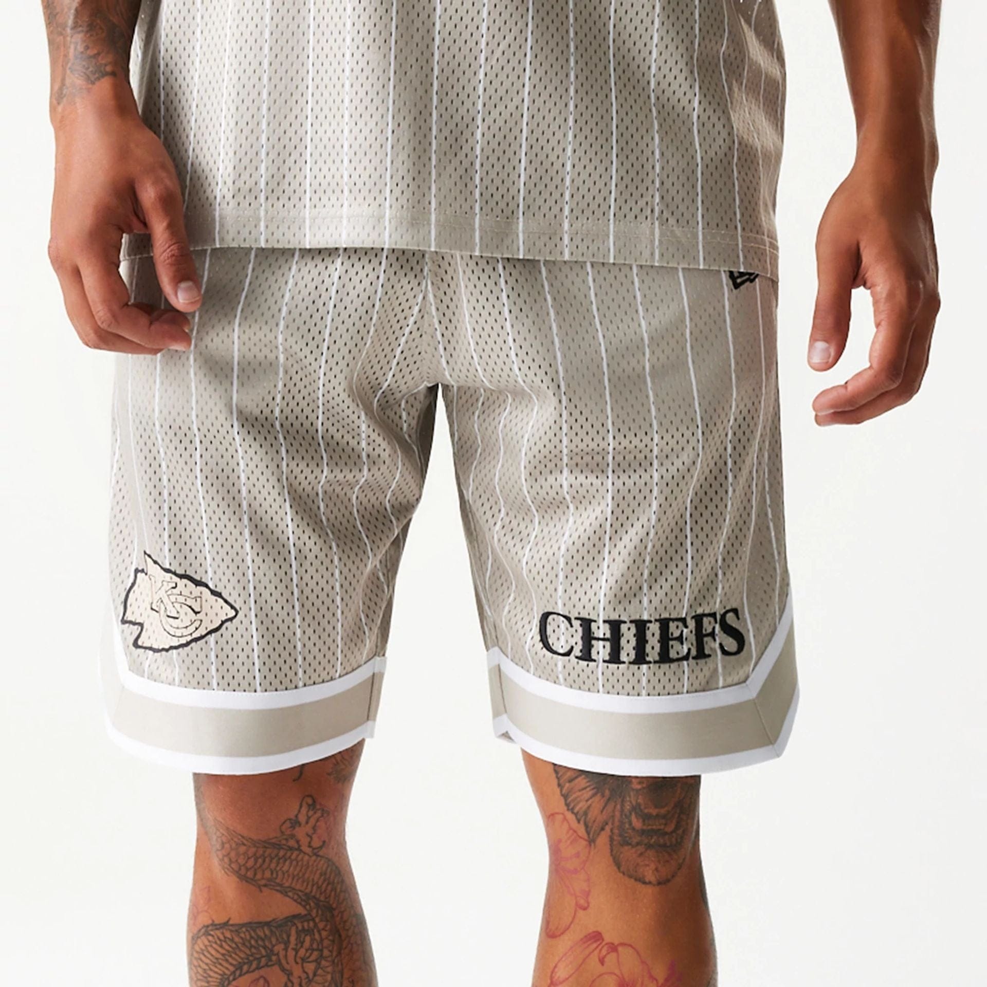 The Male model is wearing Kansas City Chiefs NFL Pinstripe Cream Shorts 3
