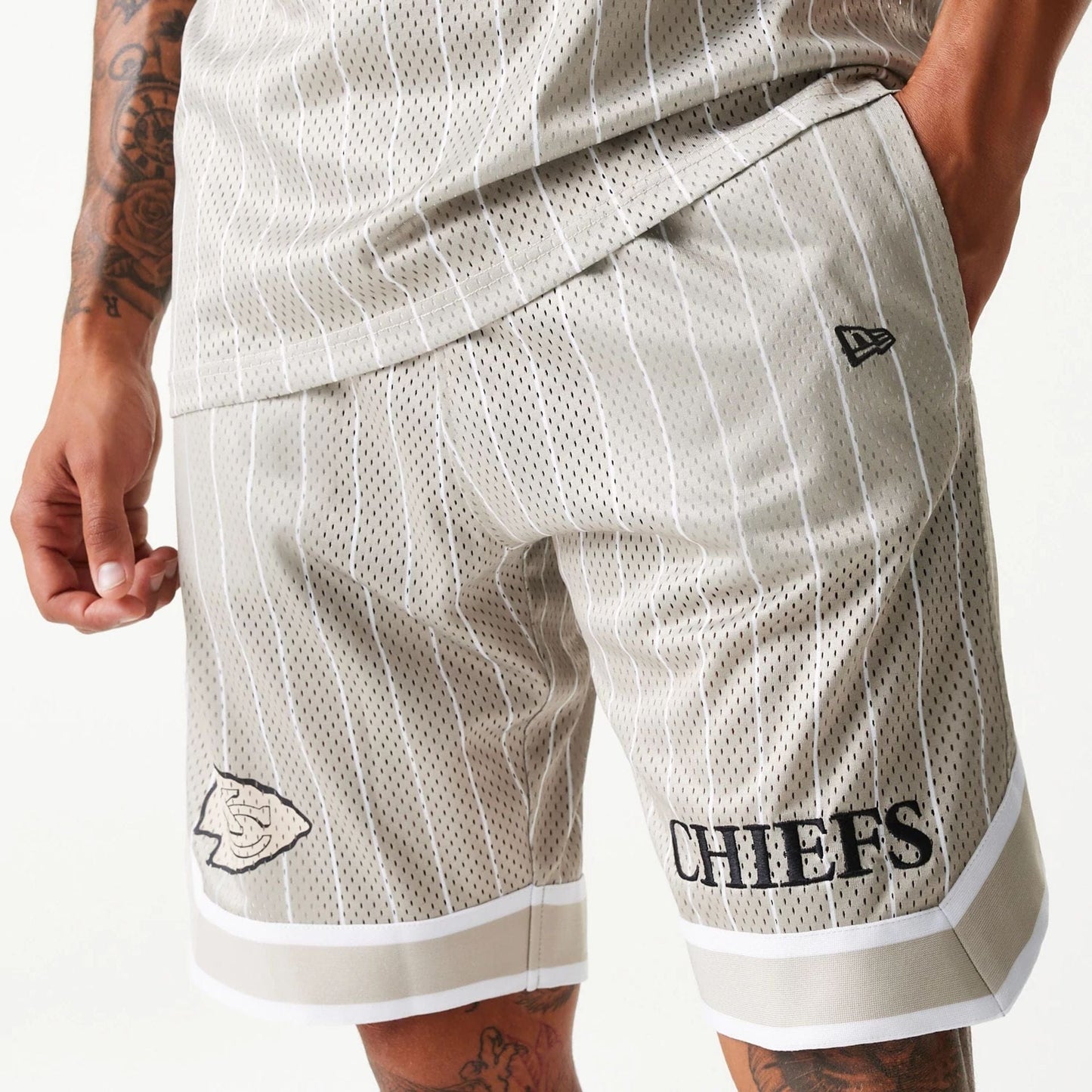 The Male model is wearing Kansas City Chiefs NFL Pinstripe Cream Shorts 5