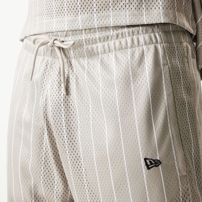 The Male model is wearing Kansas City Chiefs NFL Pinstripe Cream Shorts 6