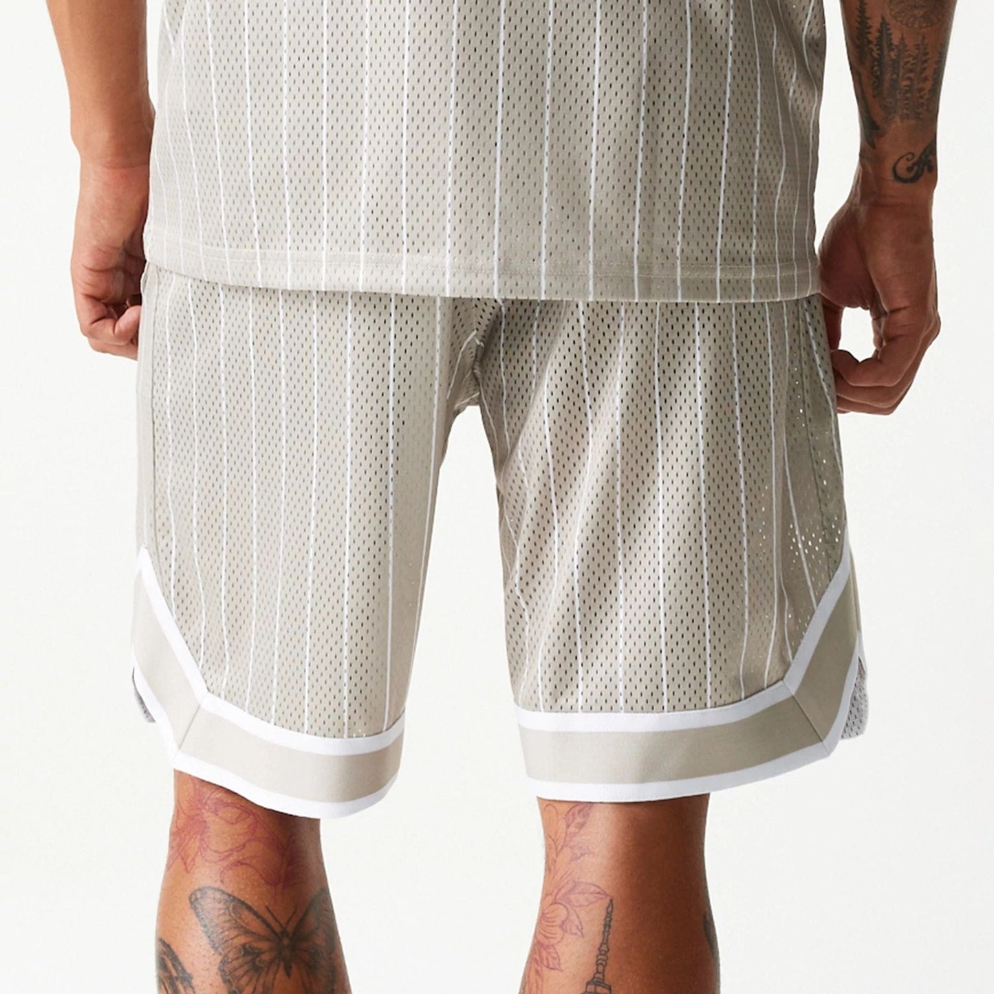 The Male model is wearing Kansas City Chiefs NFL Pinstripe Cream Shorts 7