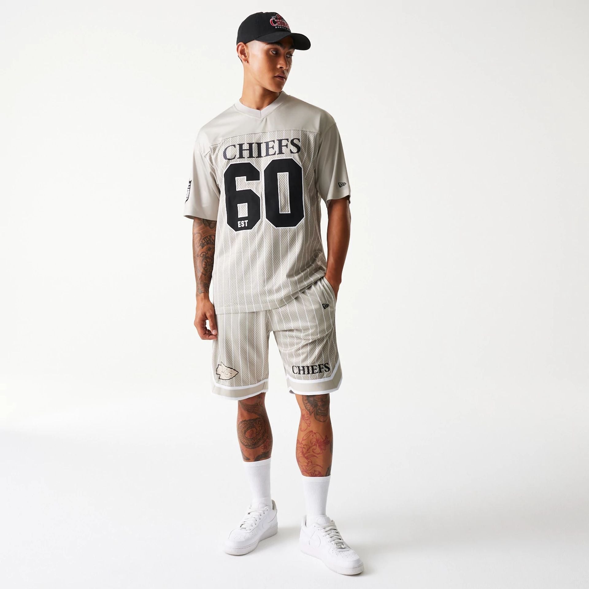 The Male model is wearing Kansas City Chiefs NFL Pinstripe Cream Shorts 8