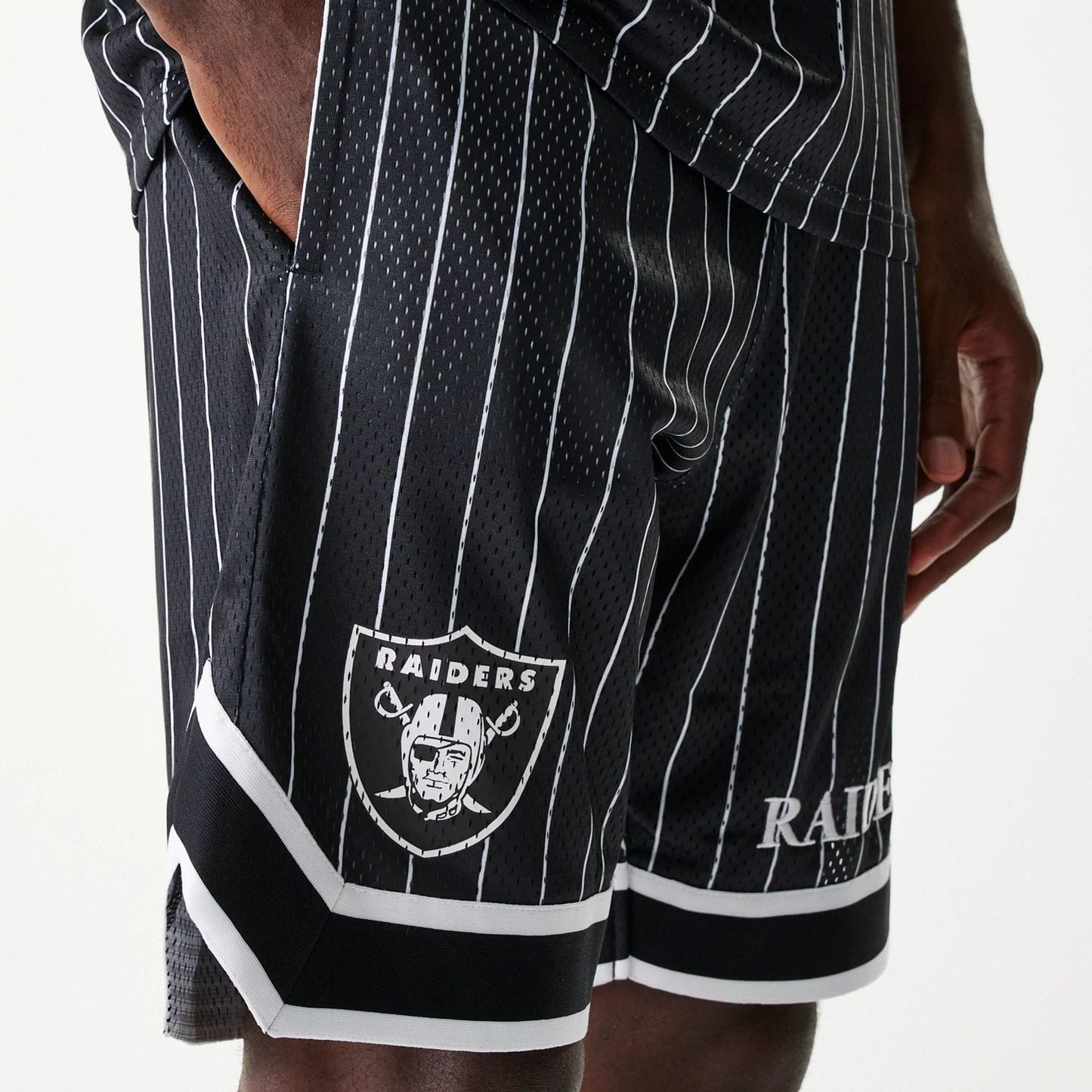 The Male model is wearing Las Vegas Raiders NFL Pinstripe Black Shorts 4