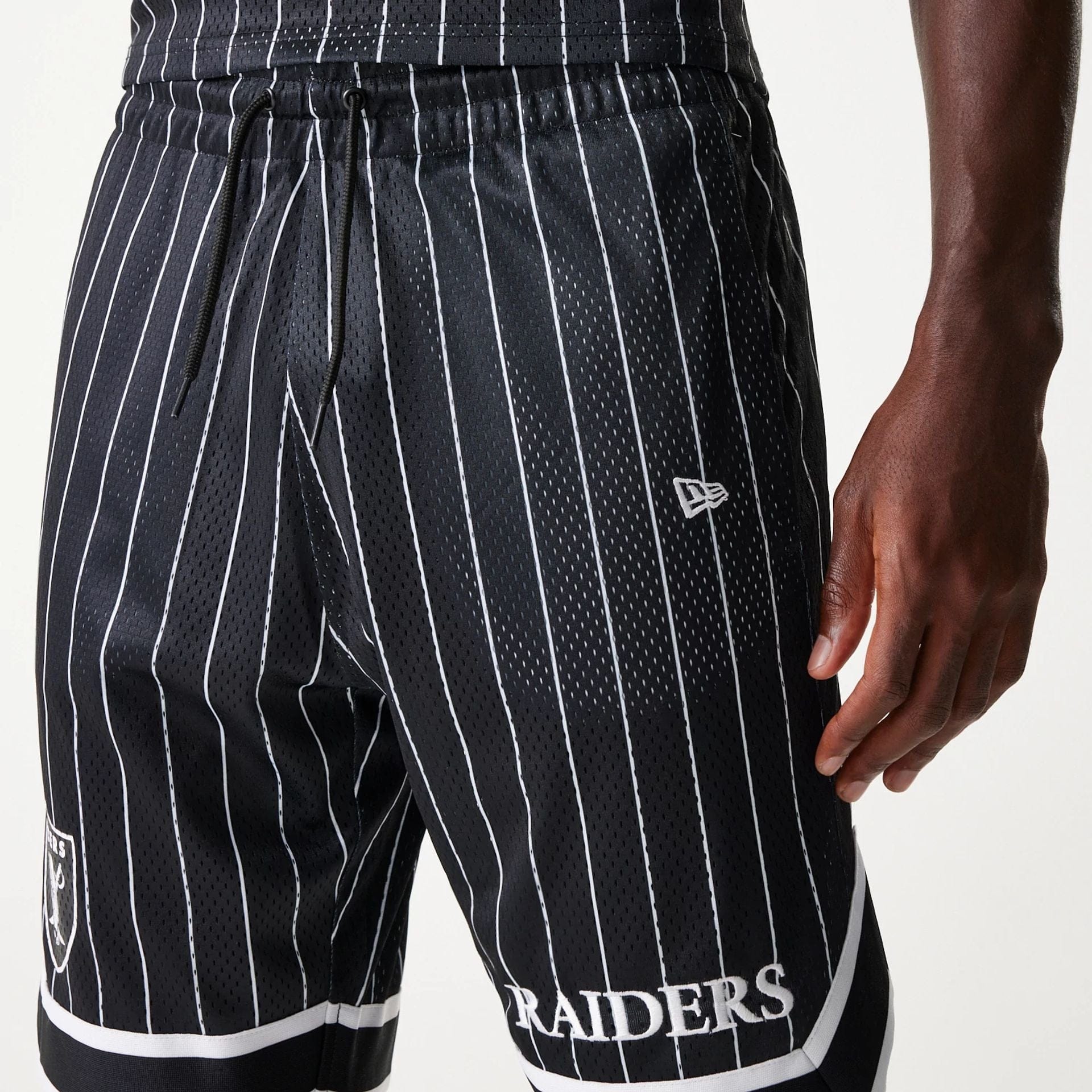 The Male model is wearing Las Vegas Raiders NFL Pinstripe Black Shorts 7