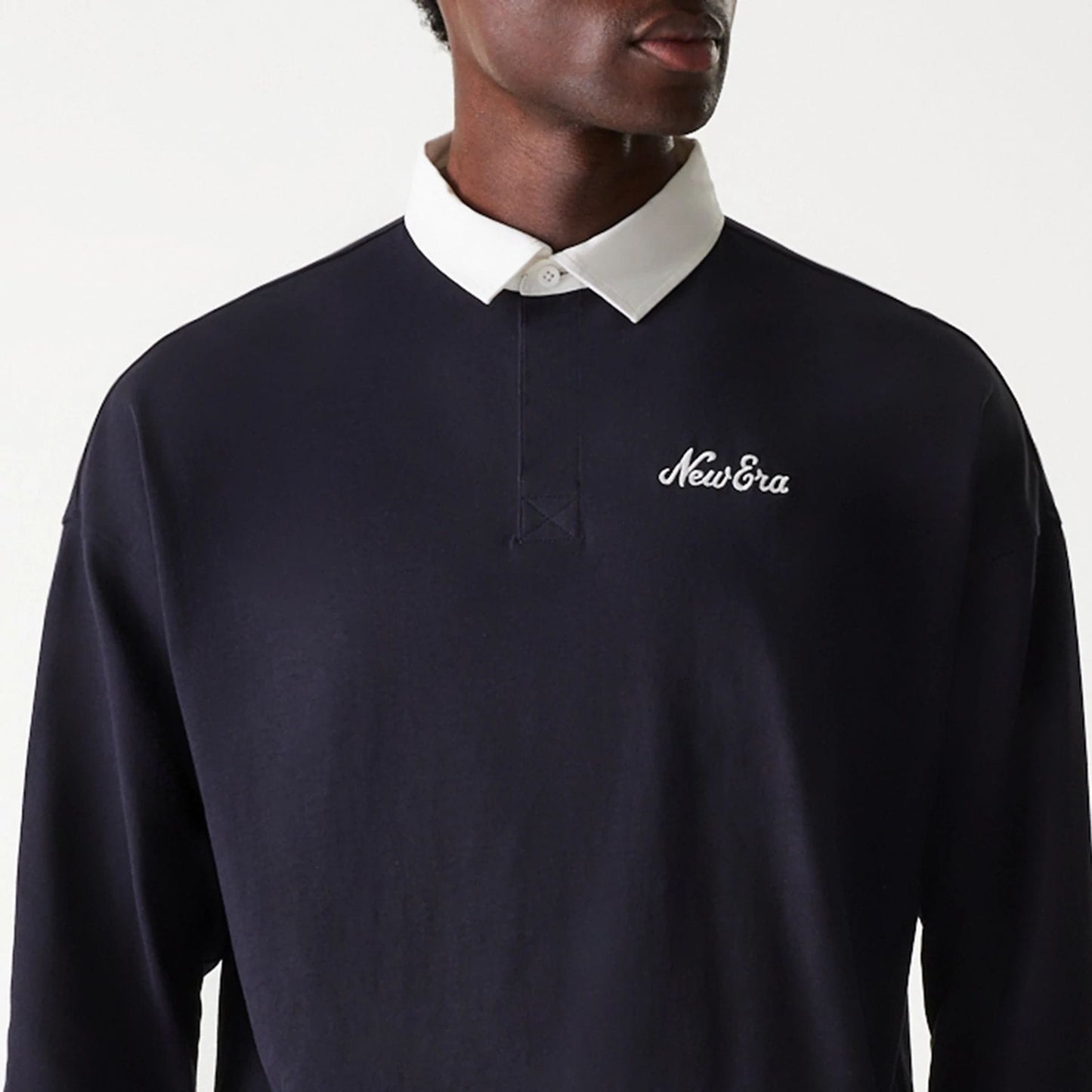 The Male model is wearing New Era Navy Oversized Rugby Shirt 4