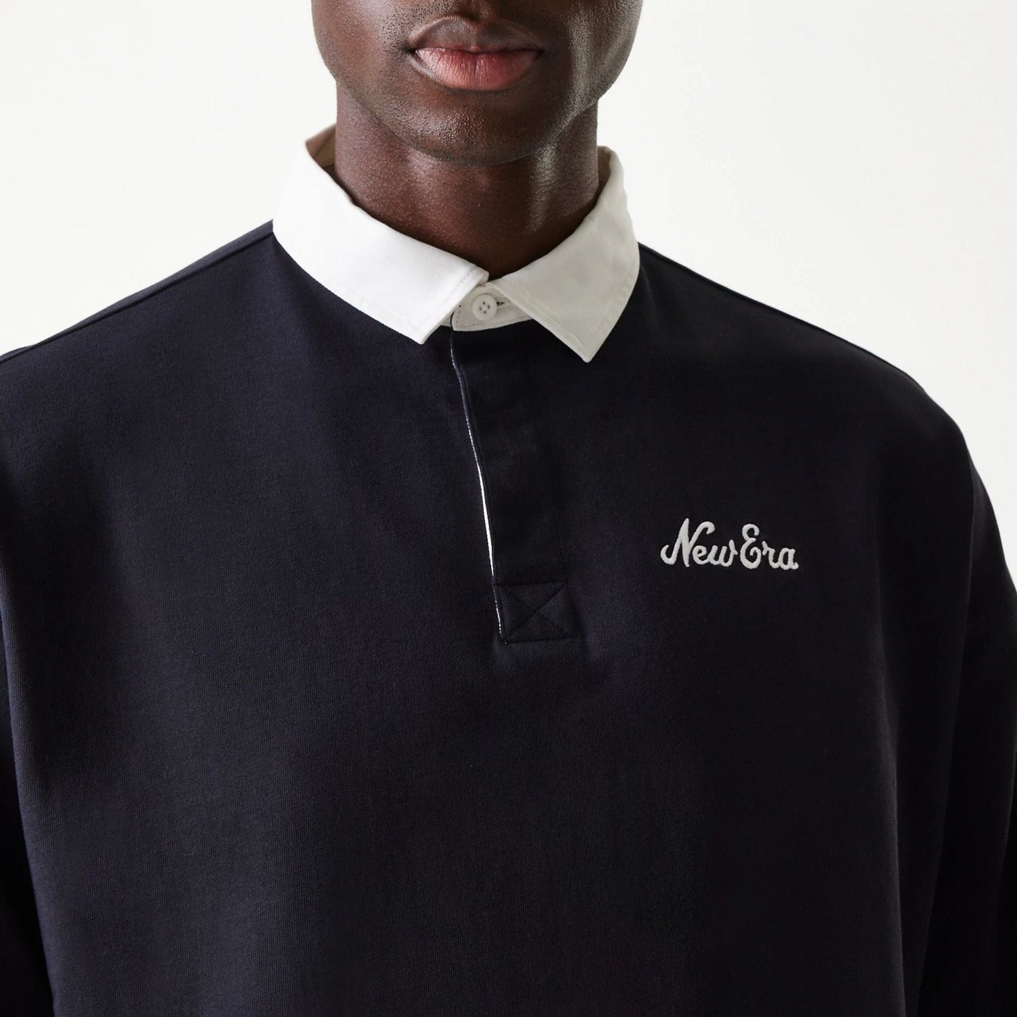 The Male model is wearing New Era Navy Oversized Rugby Shirt 3