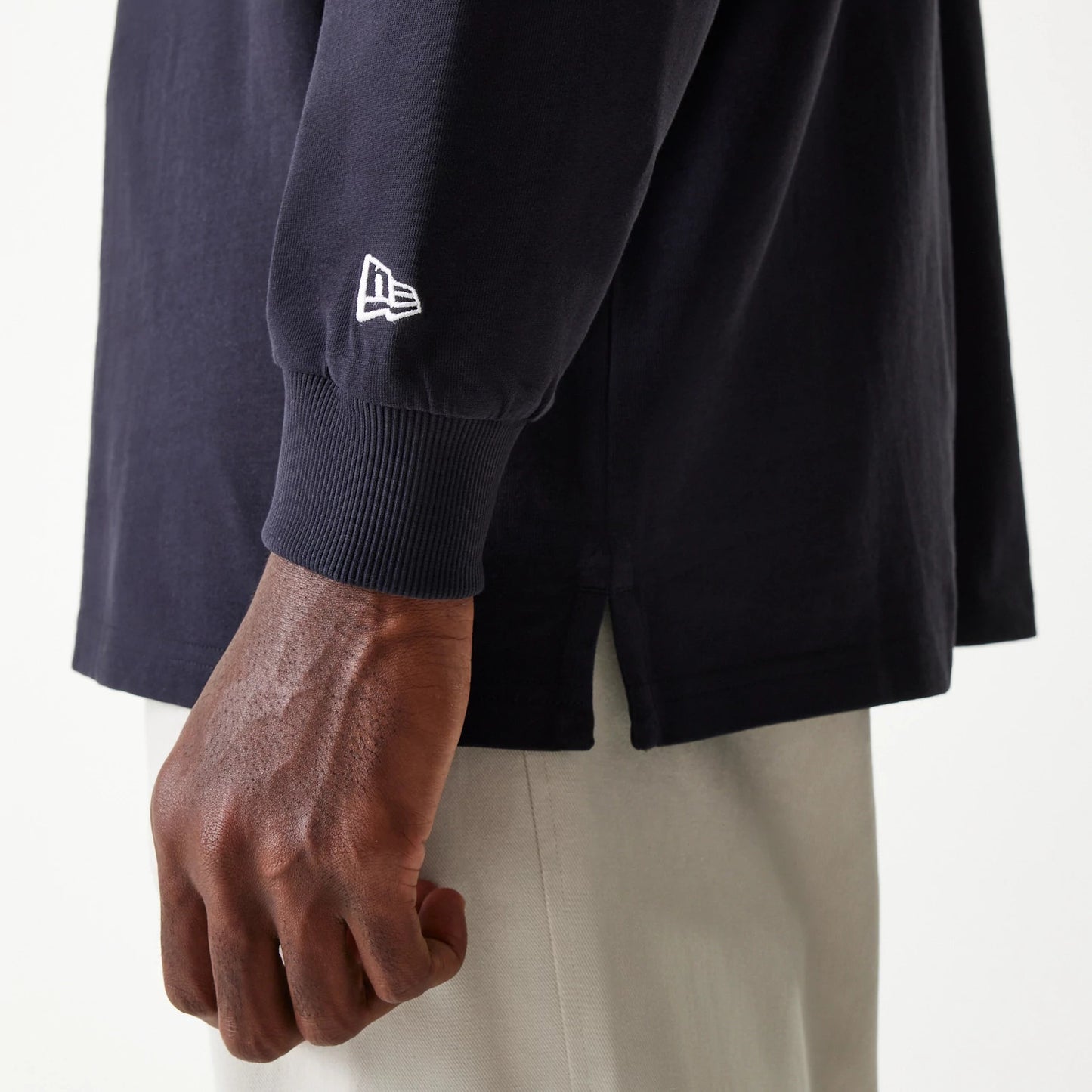 The Male model is wearing New Era Navy Oversized Rugby Shirt 5