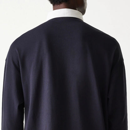 The Male model is wearing New Era Navy Oversized Rugby Shirt 7