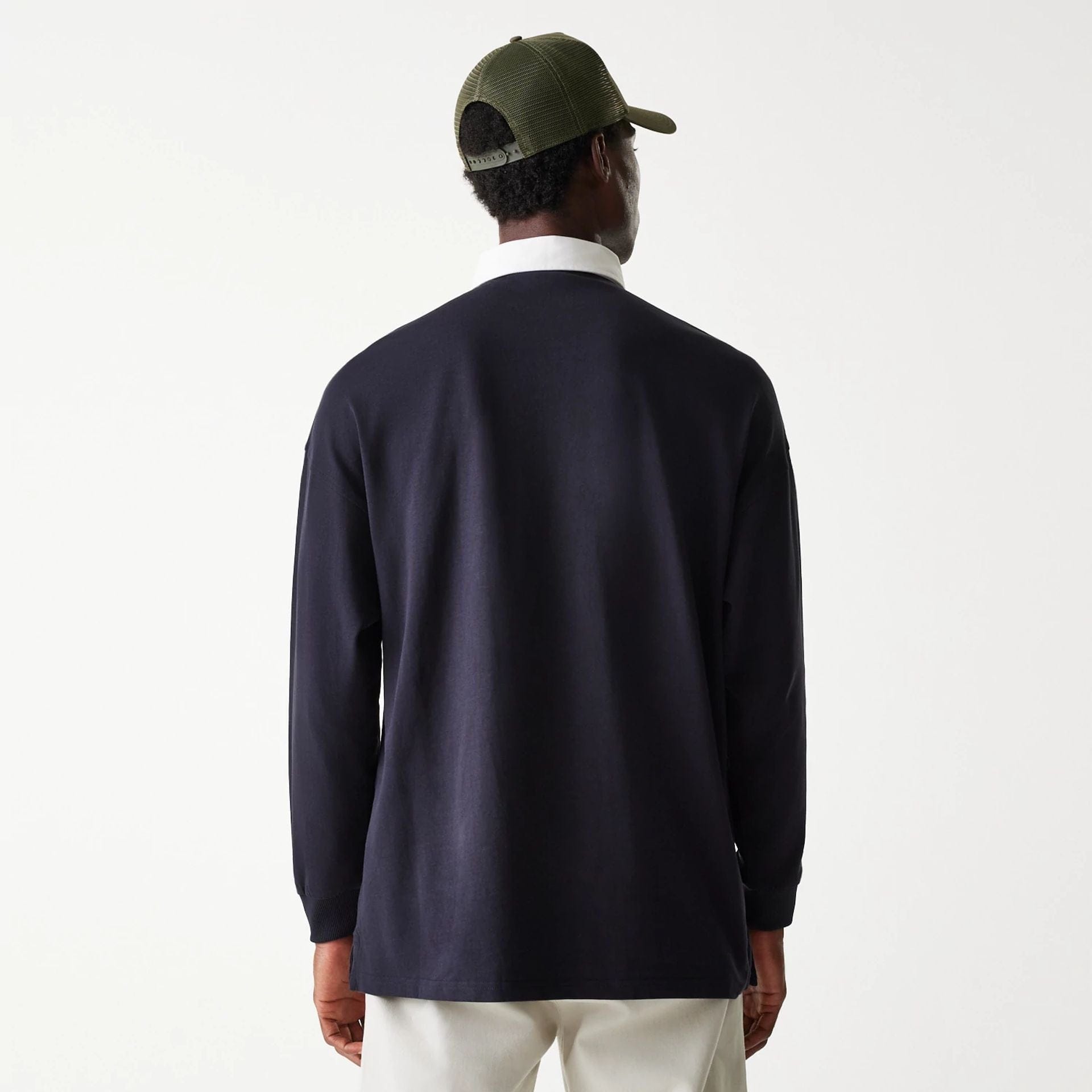The Male model is wearing New Era Navy Oversized Rugby Shirt 2