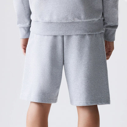 The Male model is wearing New Era Grey Oversized One Panel Shorts 7