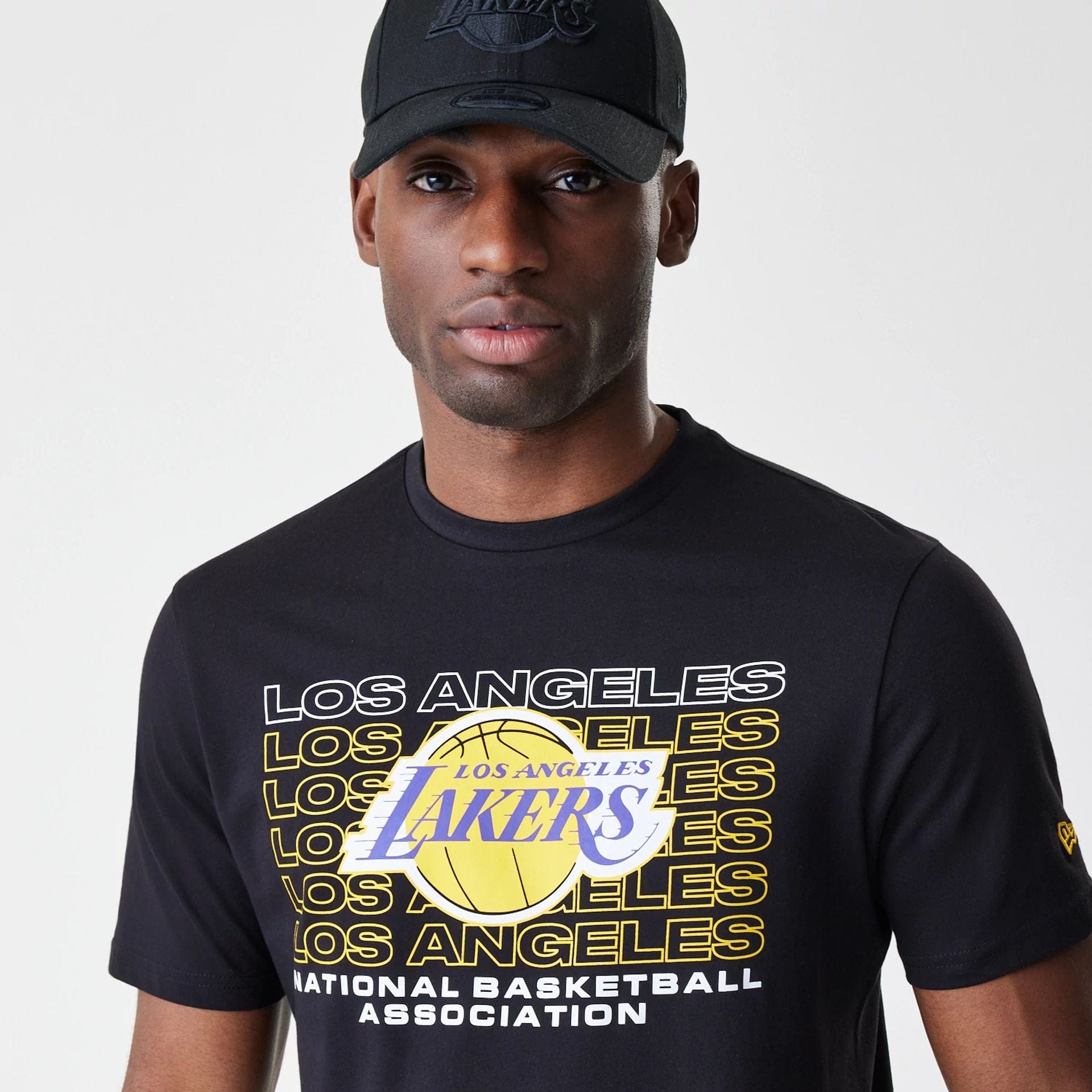 The Male model is wearing LA Lakers NBA Stack Wordmark Black T-Shirt 4
