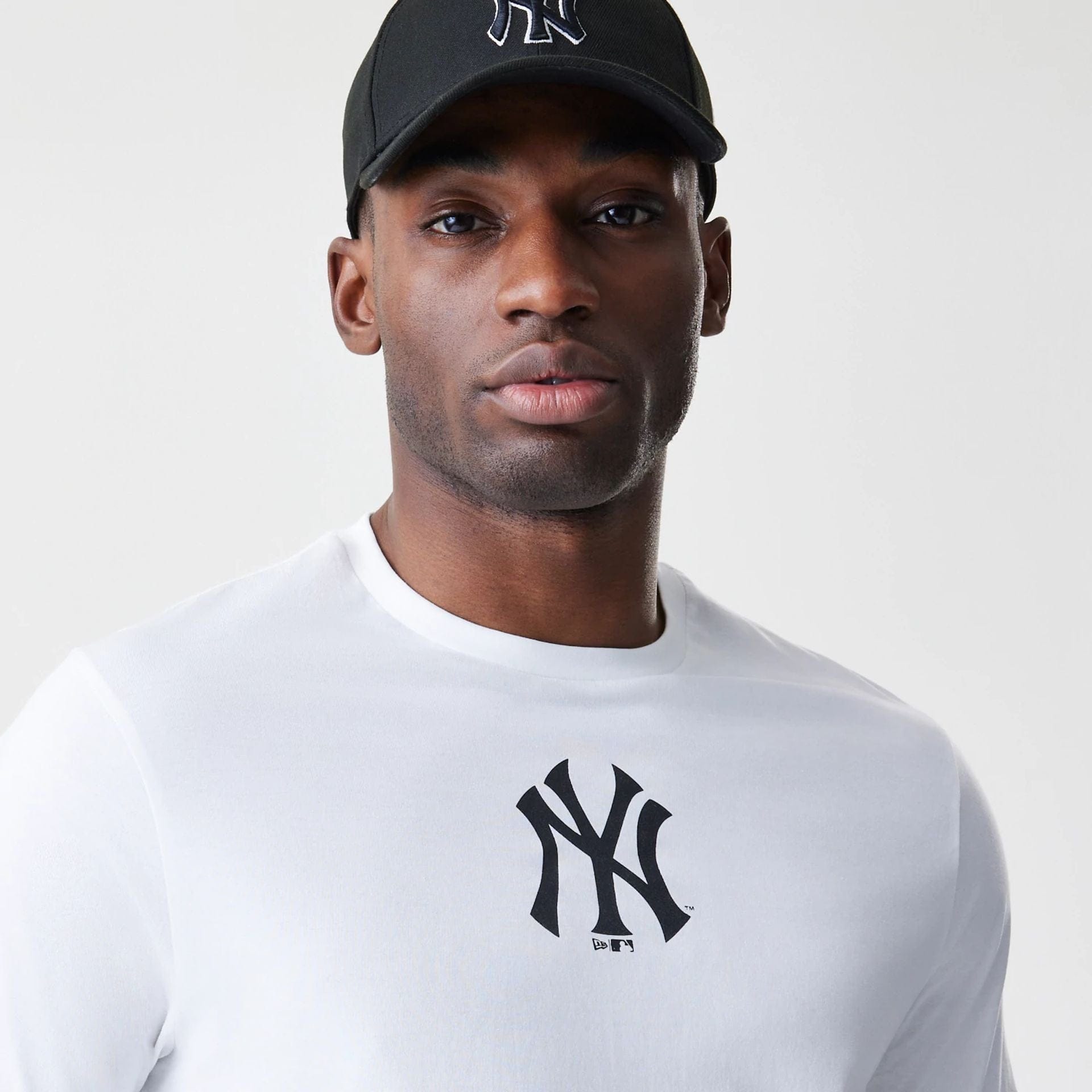 The Male model is wearing New York Yankees MLB Logo White T-Shirt 4