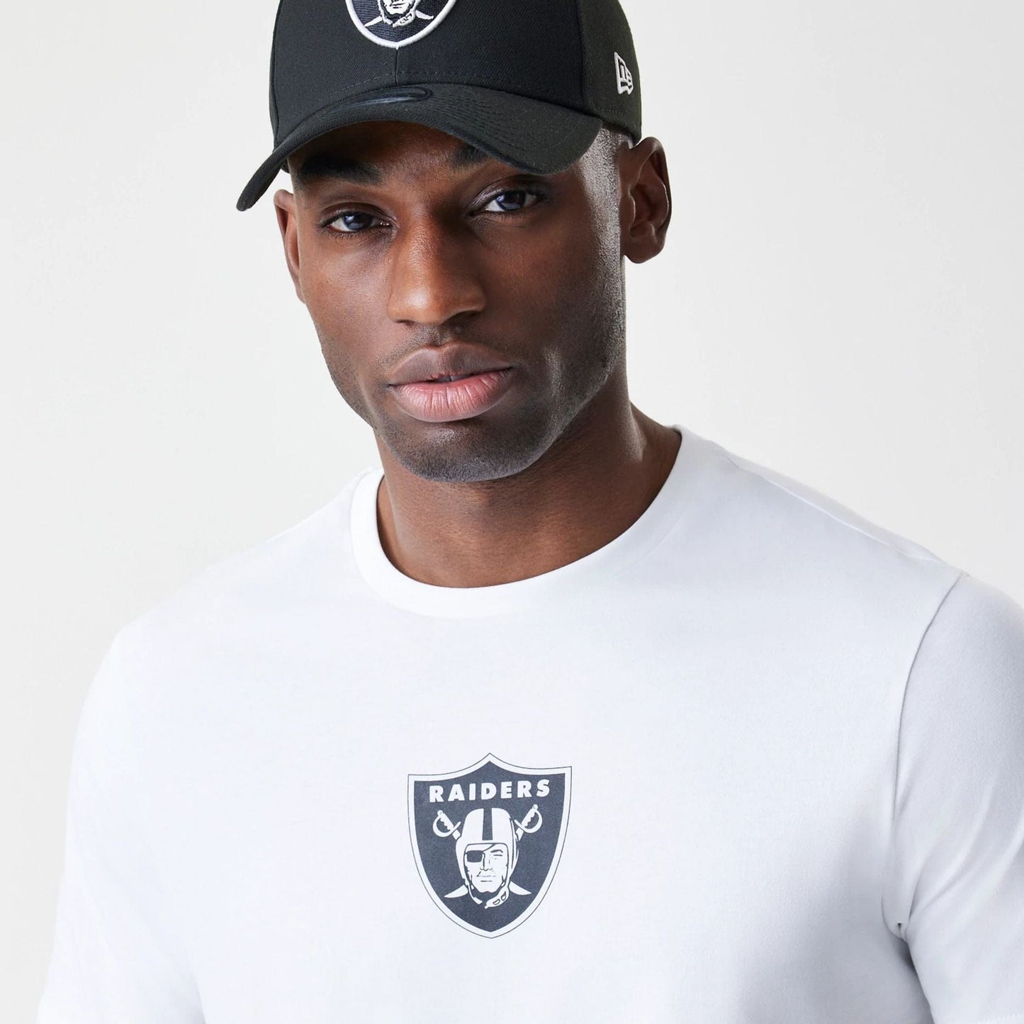 The Male model is wearing Las Vegas Raiders NFL Logo White T-Shirt 4